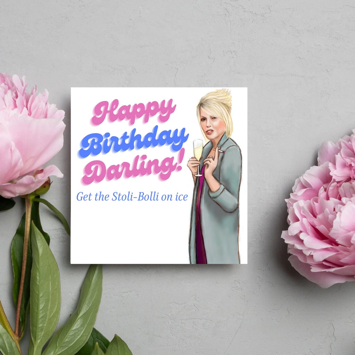 Square birthday card with hand drawn picture of patsy stone from the tv show absolutely fabulous holding a glass of champagne and a cigarette next to the text happy birthday darling, get the stoli-bolli on ice