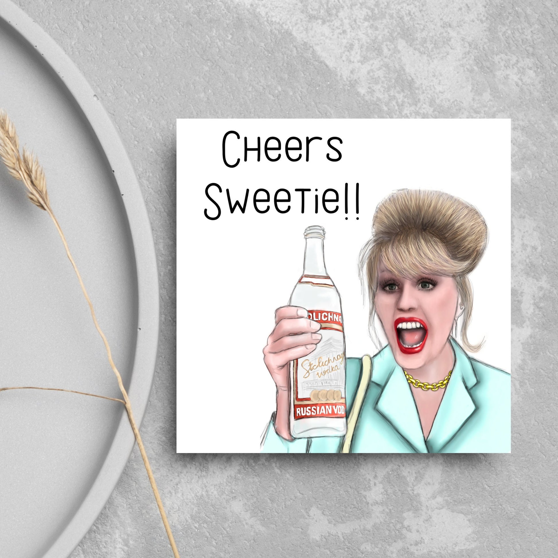 Image of a square greetings card against a grey background. The design is an illustration of Patsy Stone Holding a bottle of vodka with the text cheers sweetie!!