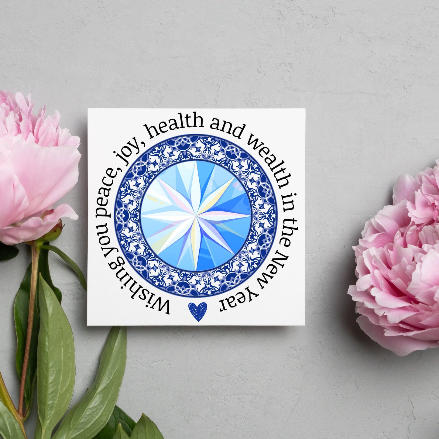 New years greeting card with the words "wishing you peace, joy, health and wealth in the new year". blue celtic circle design. card for him, card for her, solstice card