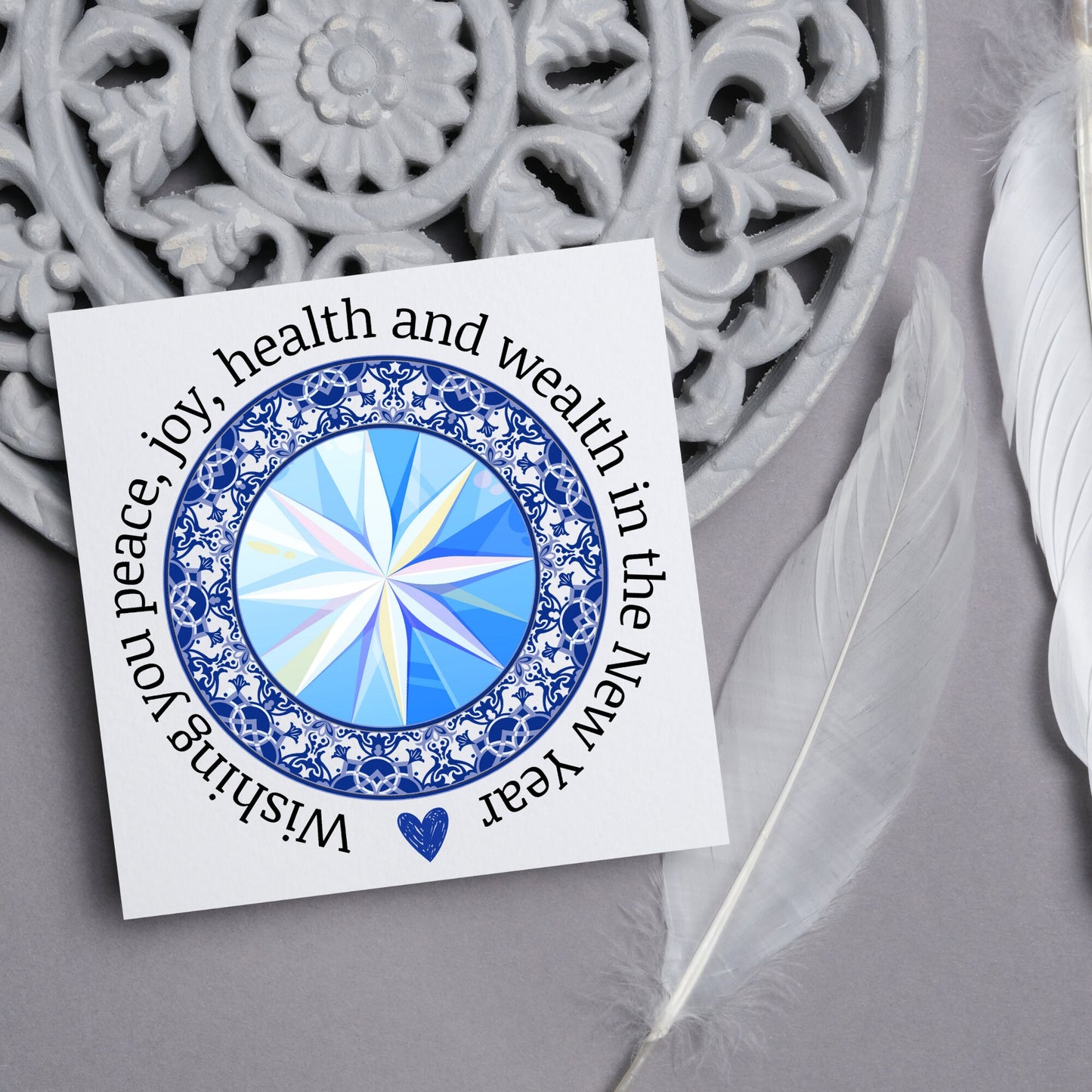 New years greeting card with the words "wishing you peace, joy, health and wealth in the new year". blue celtic circle design. card for him, card for her, solstice card
