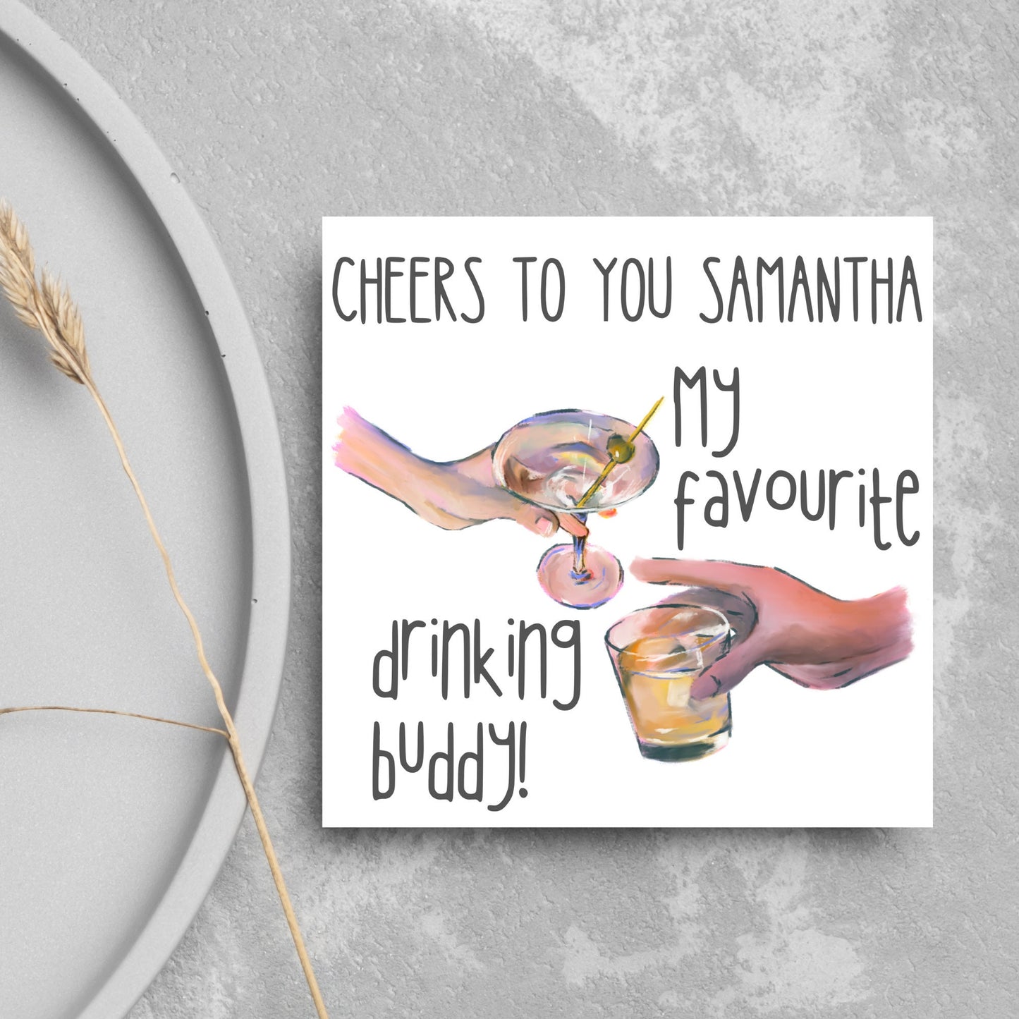 Square card with watercolour design of 2 hands holding drinks glasses against a white background, with grey text that reads "cheers to you Samantha, my favourite drinking buddy"