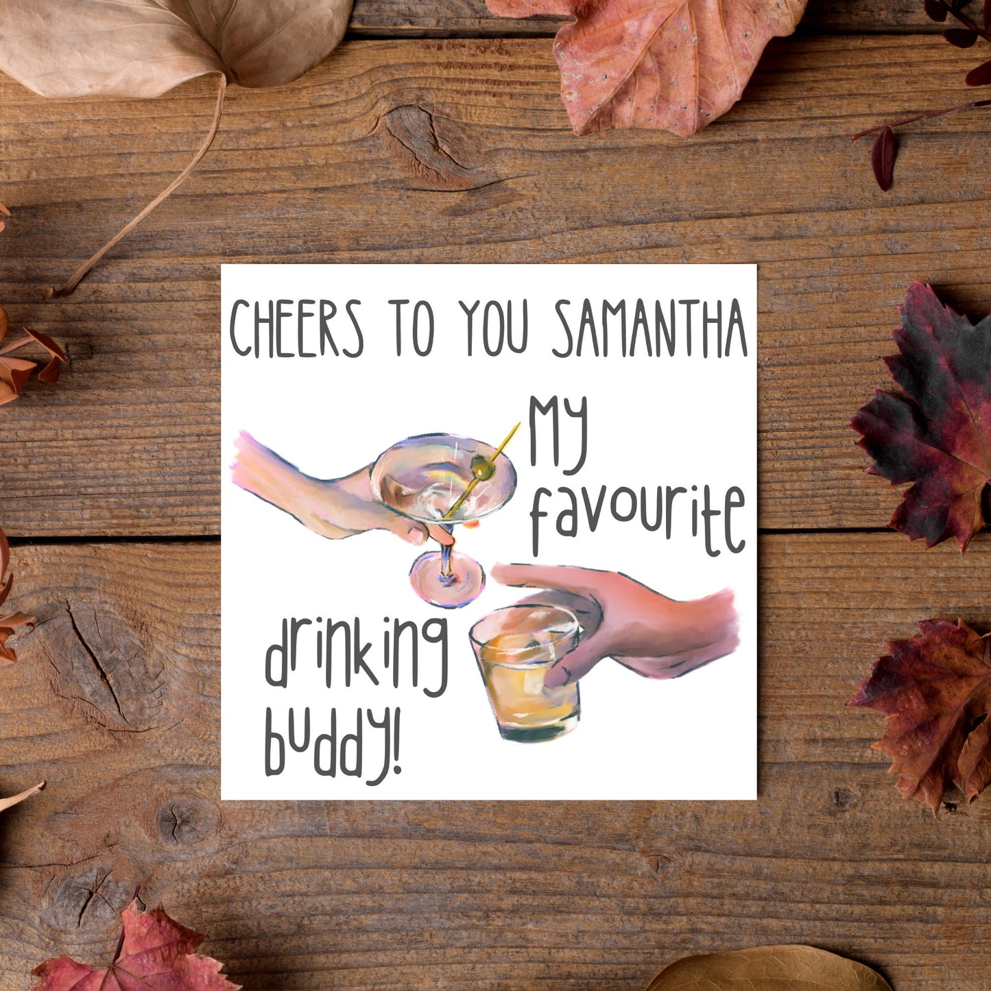 Square card with watercolour design of 2 hands holding drinks glasses against a white background, with grey text that reads "cheers to you Samantha, my favourite drinking buddy"