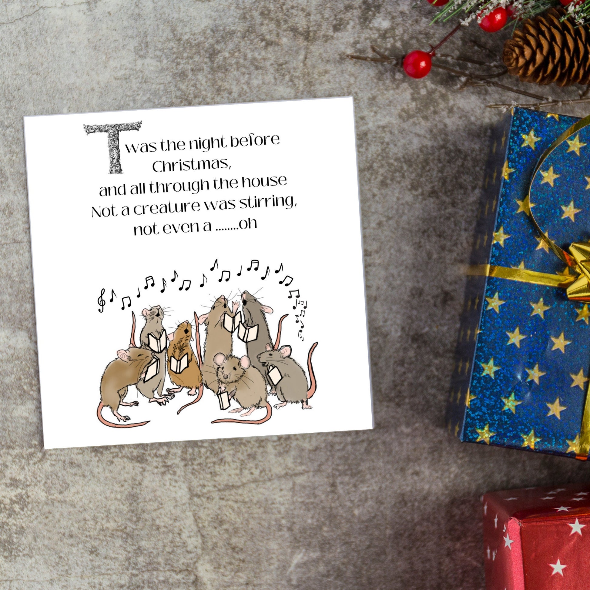 Cute mouse Christmas Card.Large Square sized christmas card with singing mice sining twas the night before christmas and all through the house not a creature was stiring not even a mouse. A christmas carol, Charles Dicken design