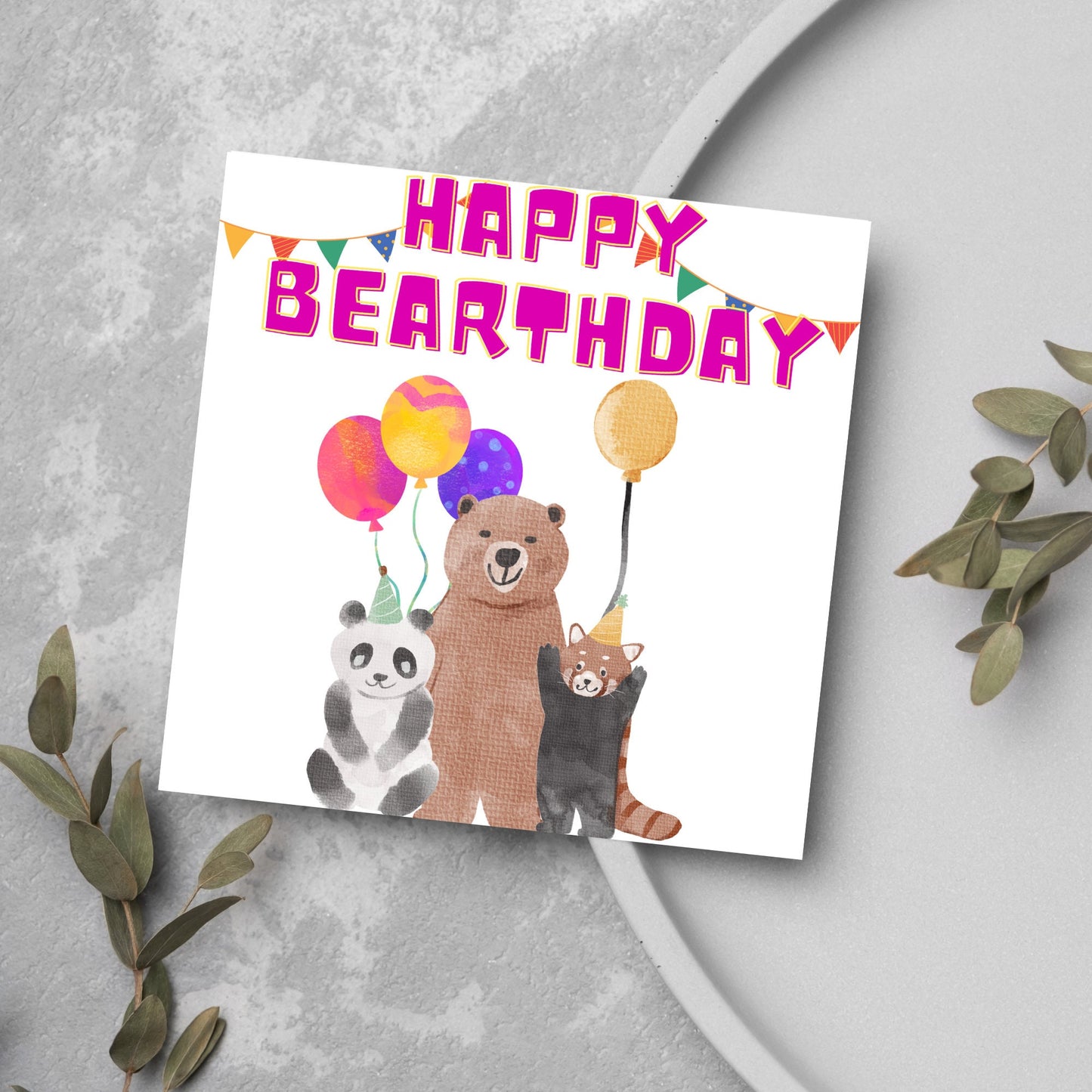 Image of a square Birthday Card. The card has a white background with a vibrant watercolour illustration of 3 bears holding balloons and big pink text that reads happy bearthday, a cute play on the traditional happy birthday.