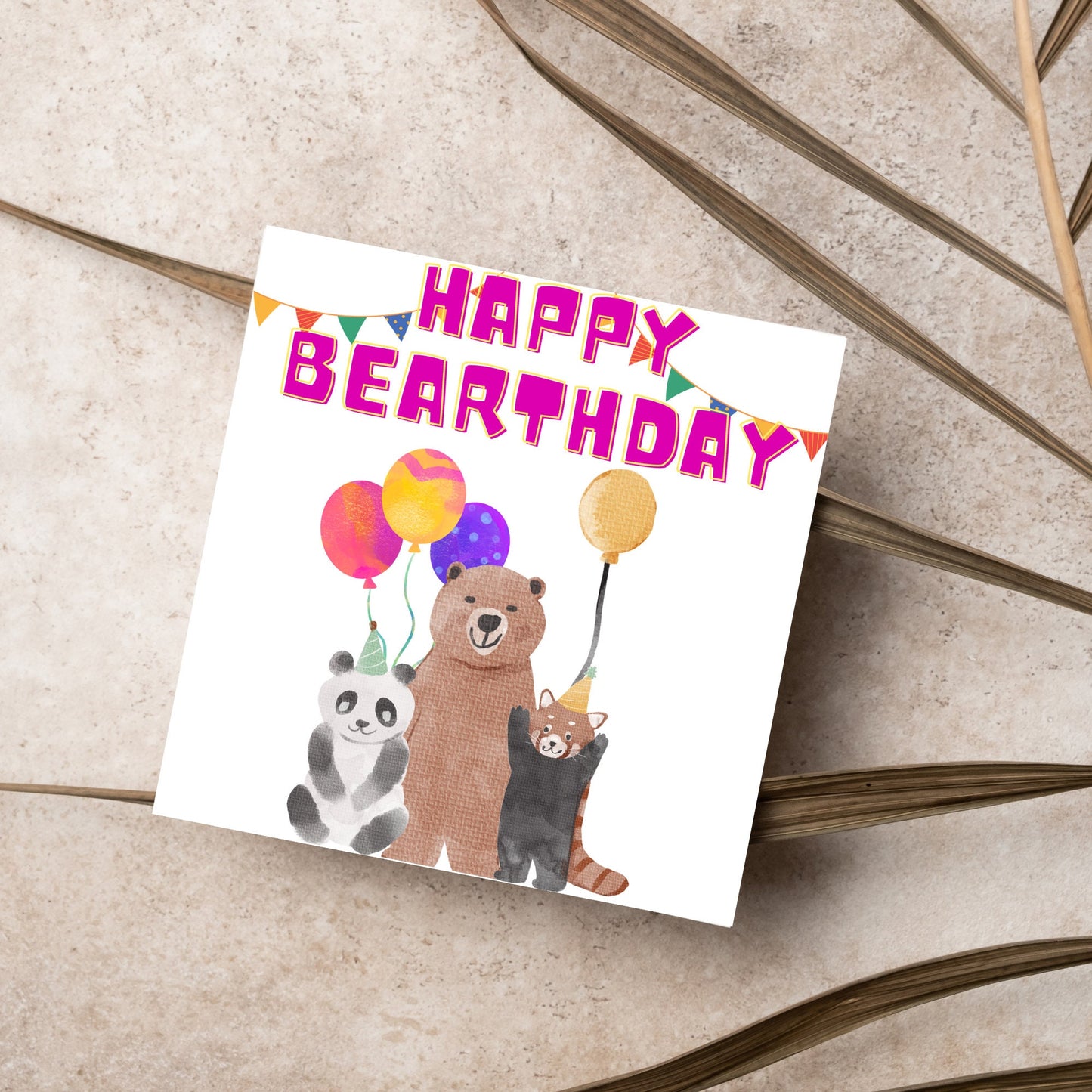 Image of a square Birthday Card. The card has a white background with a vibrant watercolour illustration of 3 bears holding balloons and big pink text that reads happy bearthday, a cute play on the traditional happy birthday.