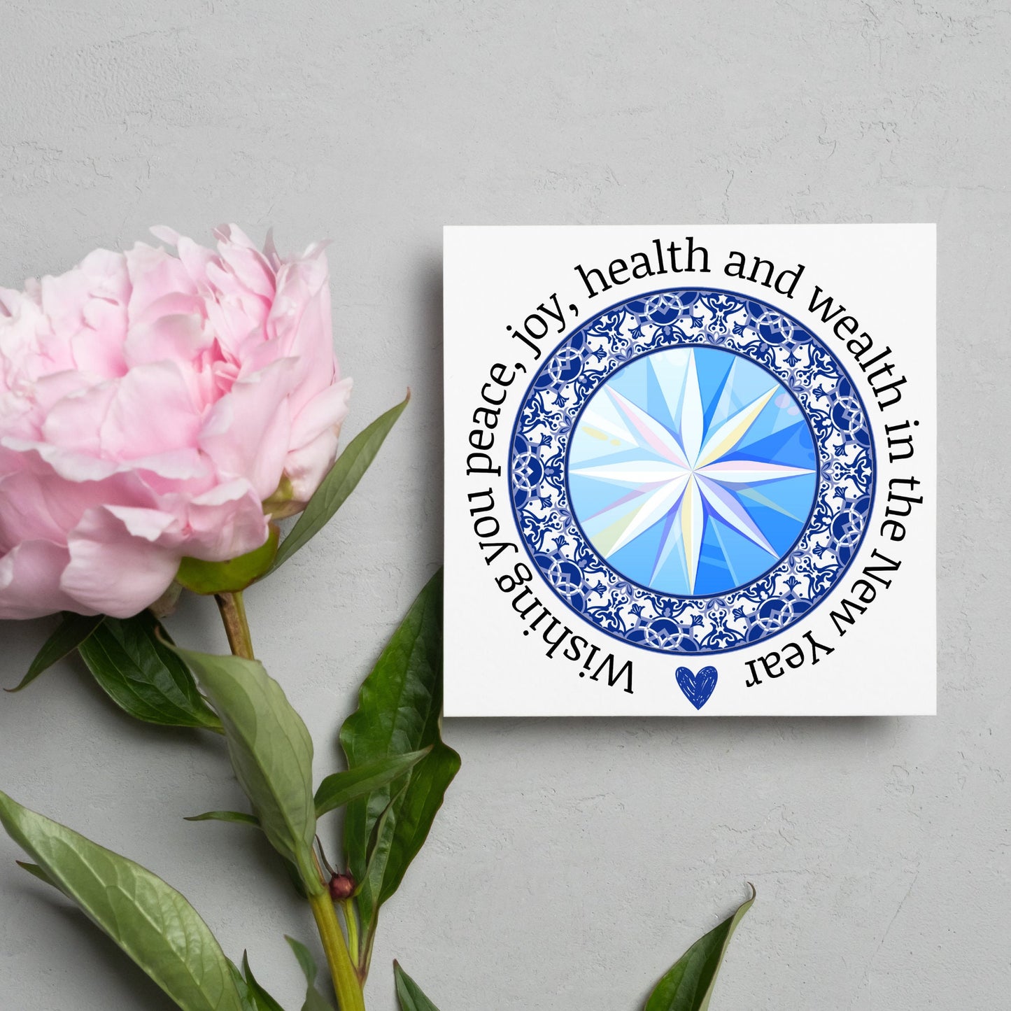 New years greeting card with the words "wishing you peace, joy, health and wealth in the new year". blue celtic circle design. card for him, card for her, solstice card