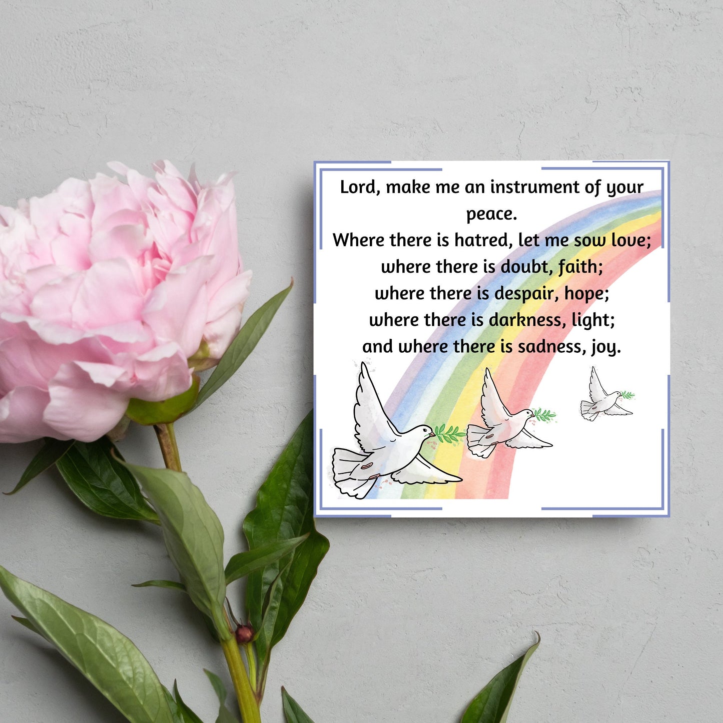 Square greetings card with 3 flying peace doves against a rainbow, with the Prayer of Saint Francis text Lord, make me an instrument of your peace.