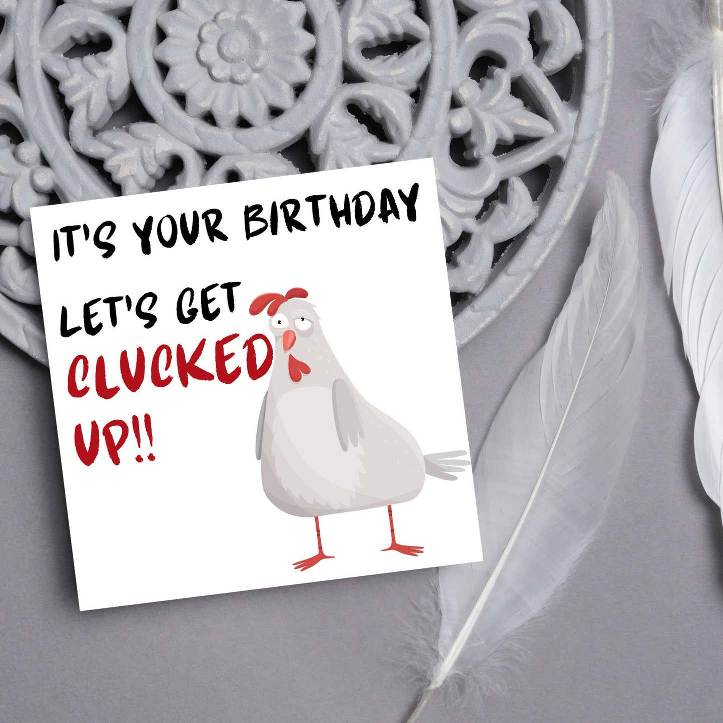 Square birthday card with a drunk looking cartoon chicken and the text 'it's your birthday, lets get clucked up!!'