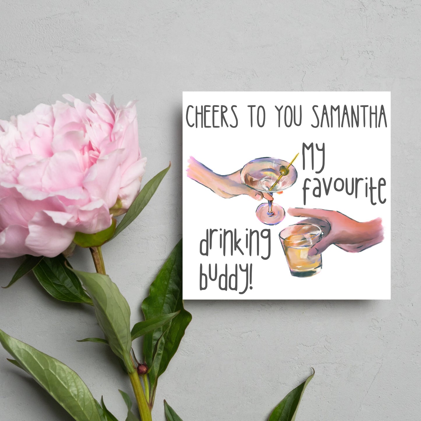 Square card with watercolour design of 2 hands holding drinks glasses against a white background, with grey text that reads "cheers to you Samantha, my favourite drinking buddy"