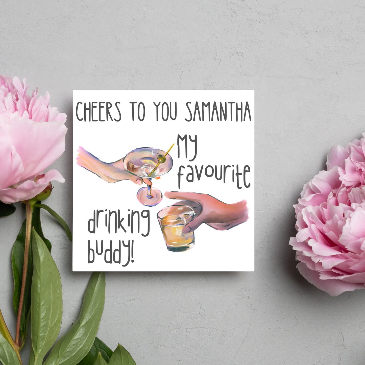 Square card with watercolour design of 2 hands holding drinks glasses against a white background, with grey text that reads "cheers to you Samantha, my favourite drinking buddy"