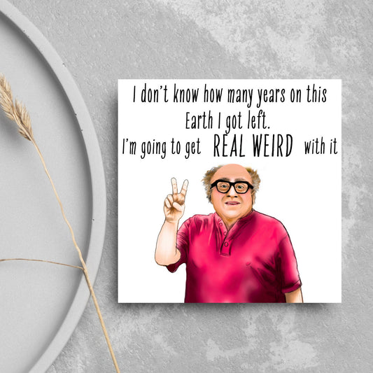 Image of a square greetings card against a grey background. The design is an illustration of Danny Devito giving a peace sign and the text 'i don't know how many years on this earth i got left. I'm going to get real weird with it