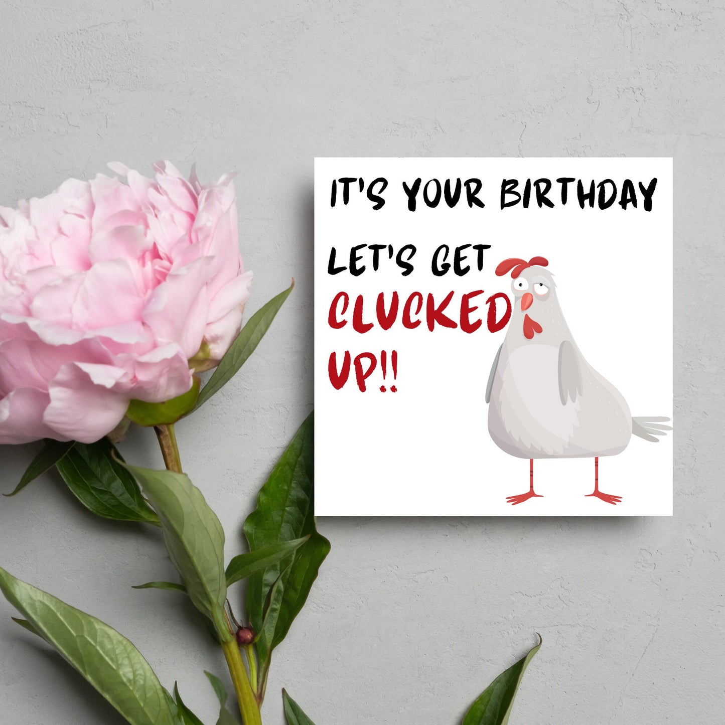 Square birthday card with a drunk looking cartoon chicken and the text 'it's your birthday, lets get clucked up!!'