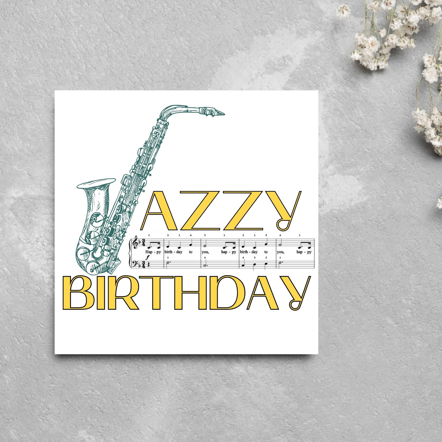 The Birthday Card has an image of a saxaphone in the shape of a 'J' along with the word have a Jazzy Birthday. The Card depicts a music sheet of Happy Birthday. This Card is ideal for musicians