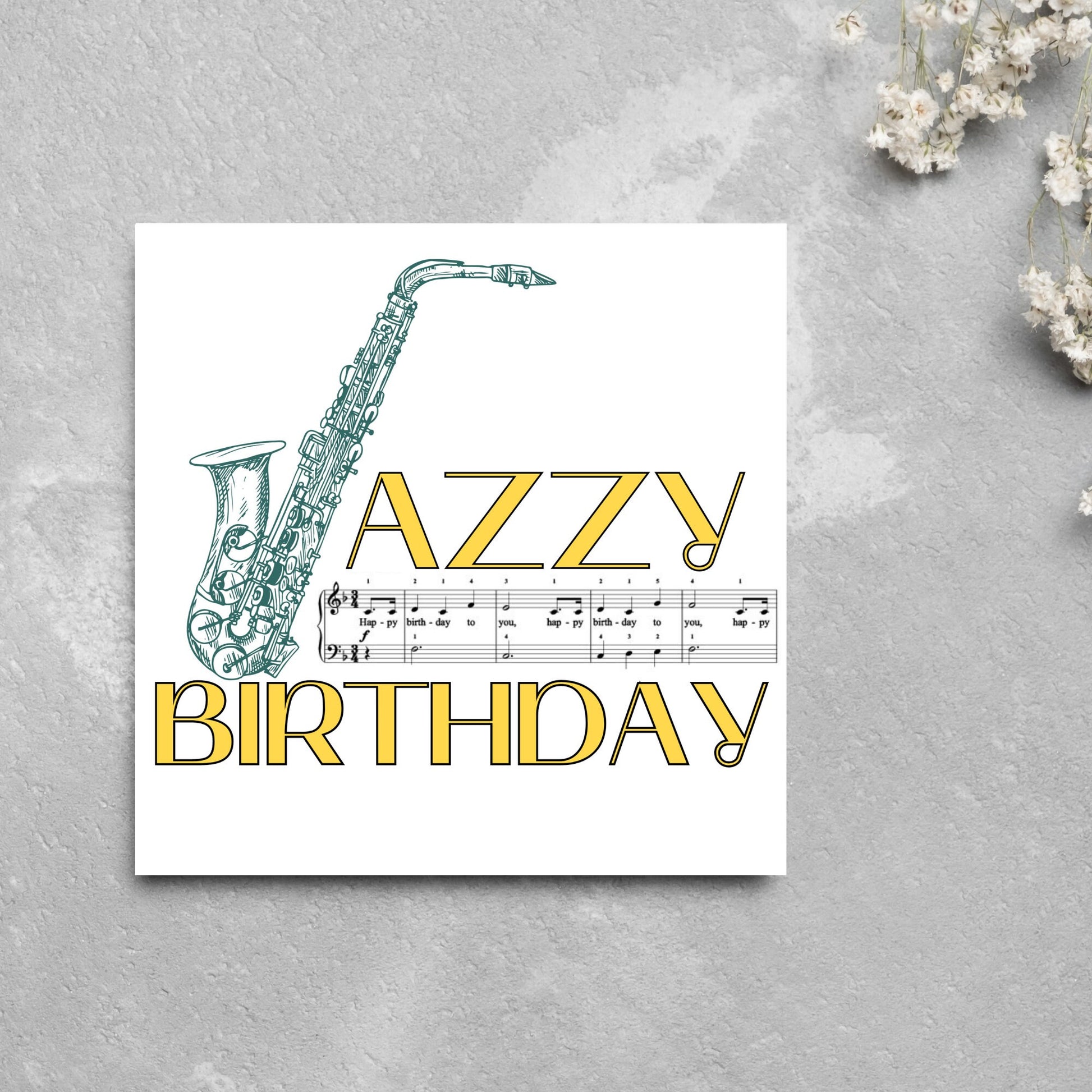 The Birthday Card has an image of a saxaphone in the shape of a 'J' along with the word have a Jazzy Birthday. The Card depicts a music sheet of Happy Birthday. This Card is ideal for musicians