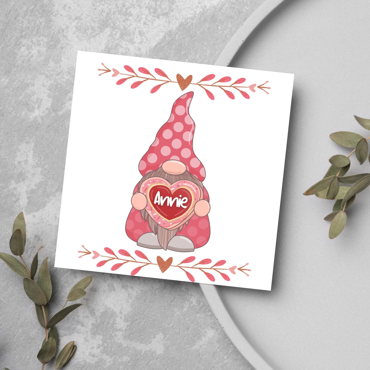 The Square Card has a cute gonk holding a love heart with a perssonalised name, the card has a cute heart header and footer, The Card is a cute representation of love, The Card is perfect for your valentines