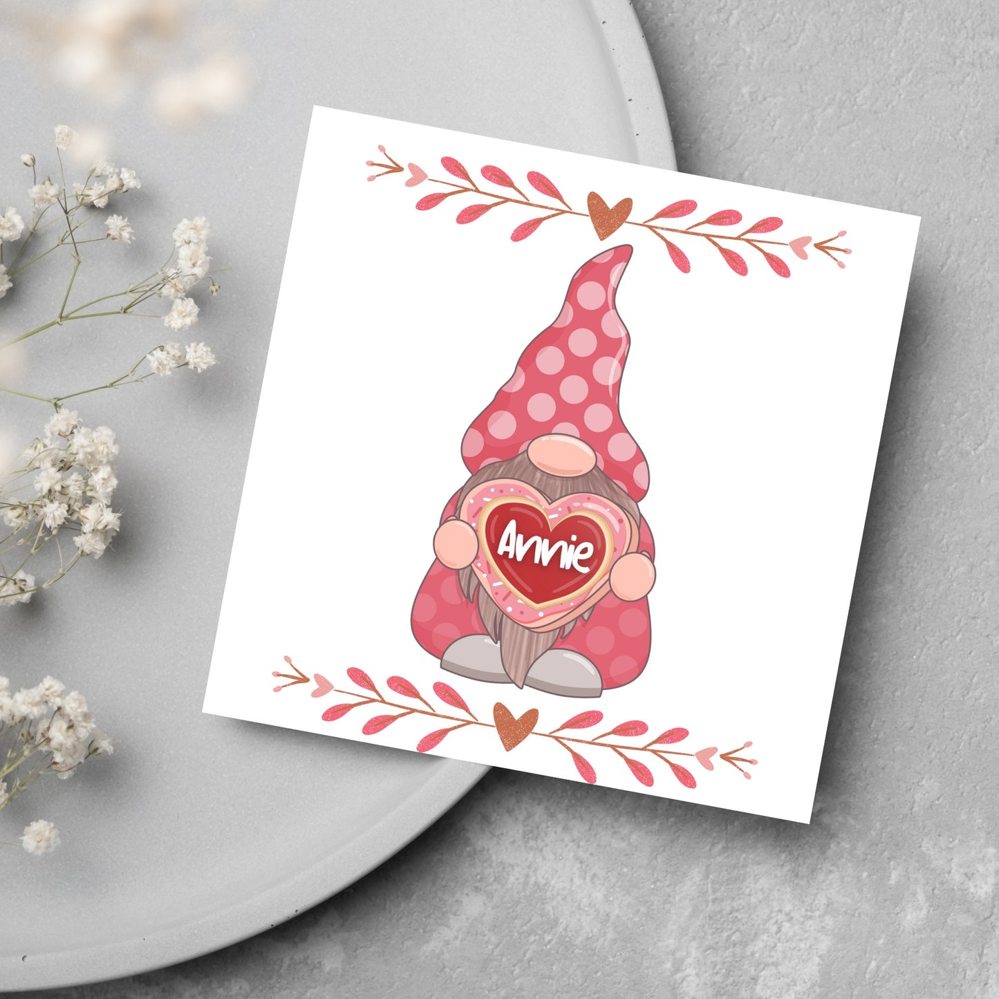 The Square Card has a cute gonk holding a love heart with a perssonalised name, the card has a cute heart header and footer, The Card is a cute representation of love, The Card is perfect for your valentines
