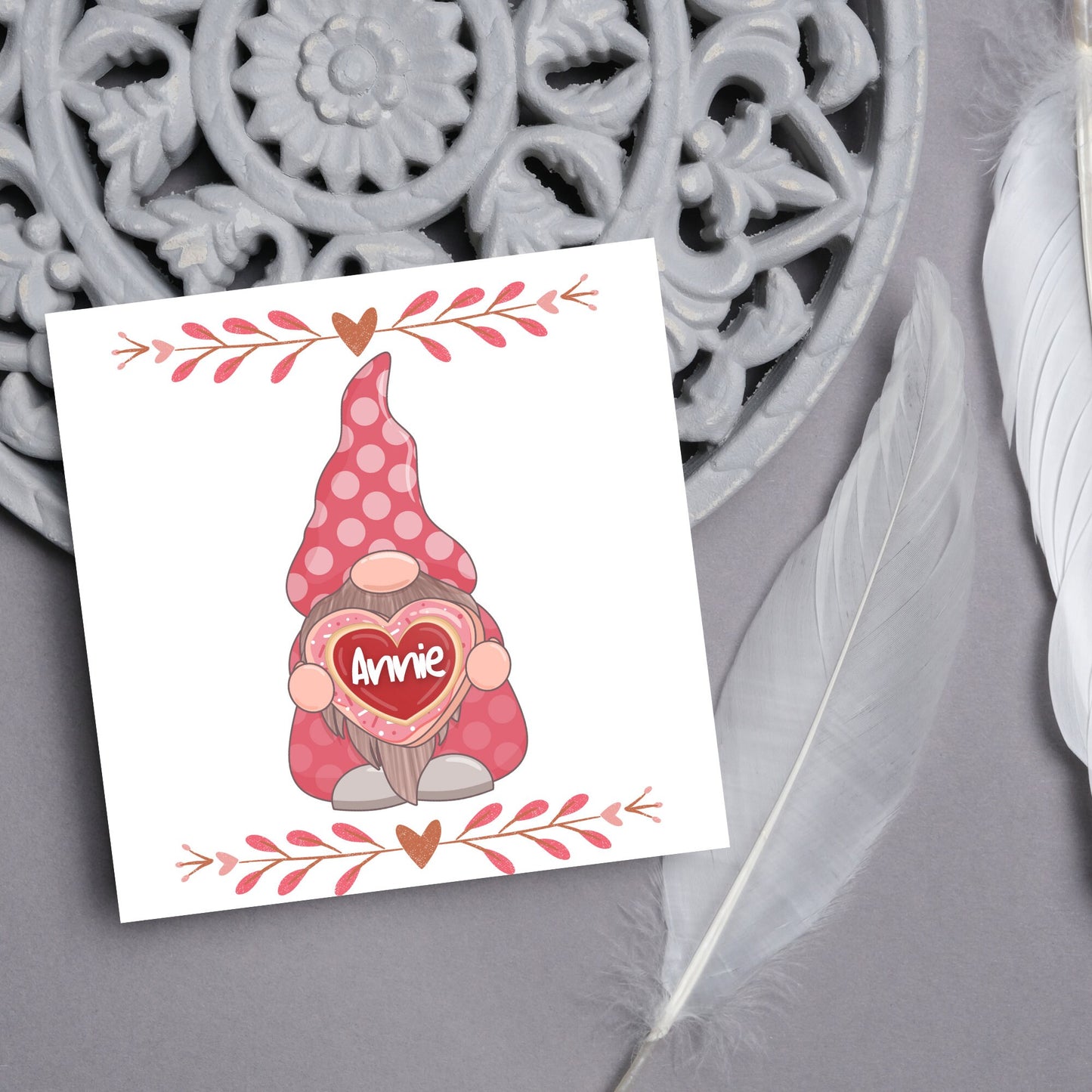 The Square Card has a cute gonk holding a love heart with a perssonalised name, the card has a cute heart header and footer, The Card is a cute representation of love, The Card is perfect for your valentines