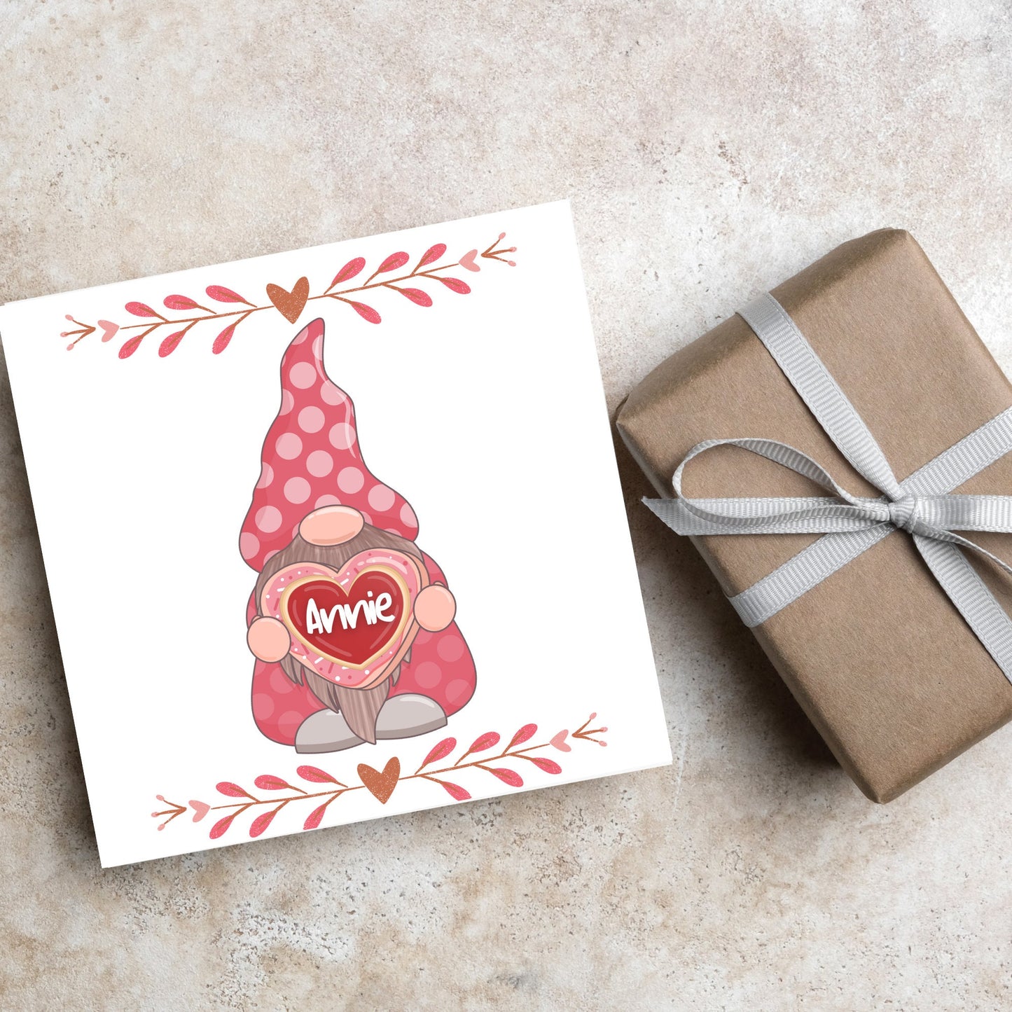 The Square Card has a cute gonk holding a love heart with a perssonalised name, the card has a cute heart header and footer, The Card is a cute representation of love, The Card is perfect for your valentines