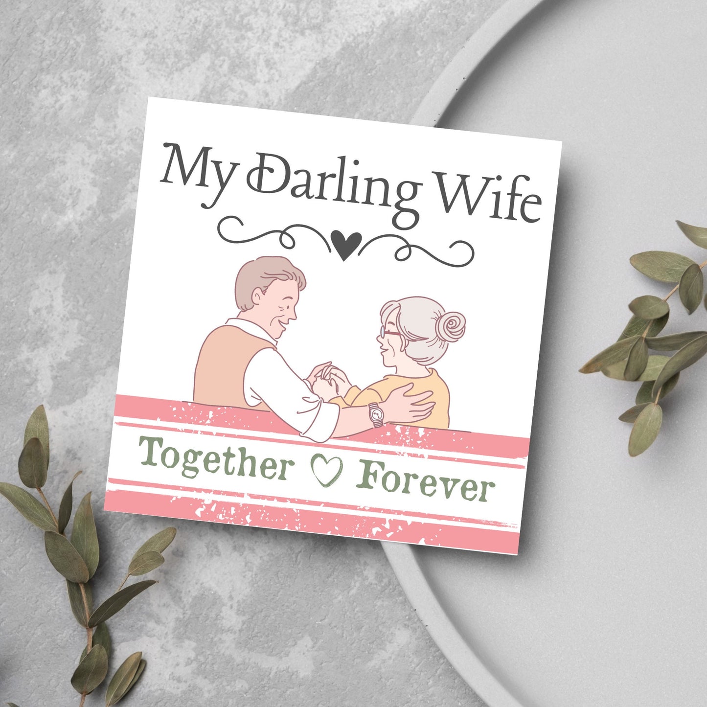 The Card has an illistration of a married couple holding hands. The Caption Reads 'My Darling Wife - Together Forever'. The Card is printed in pastel tones and is perfect for anniversaries or valentines day.