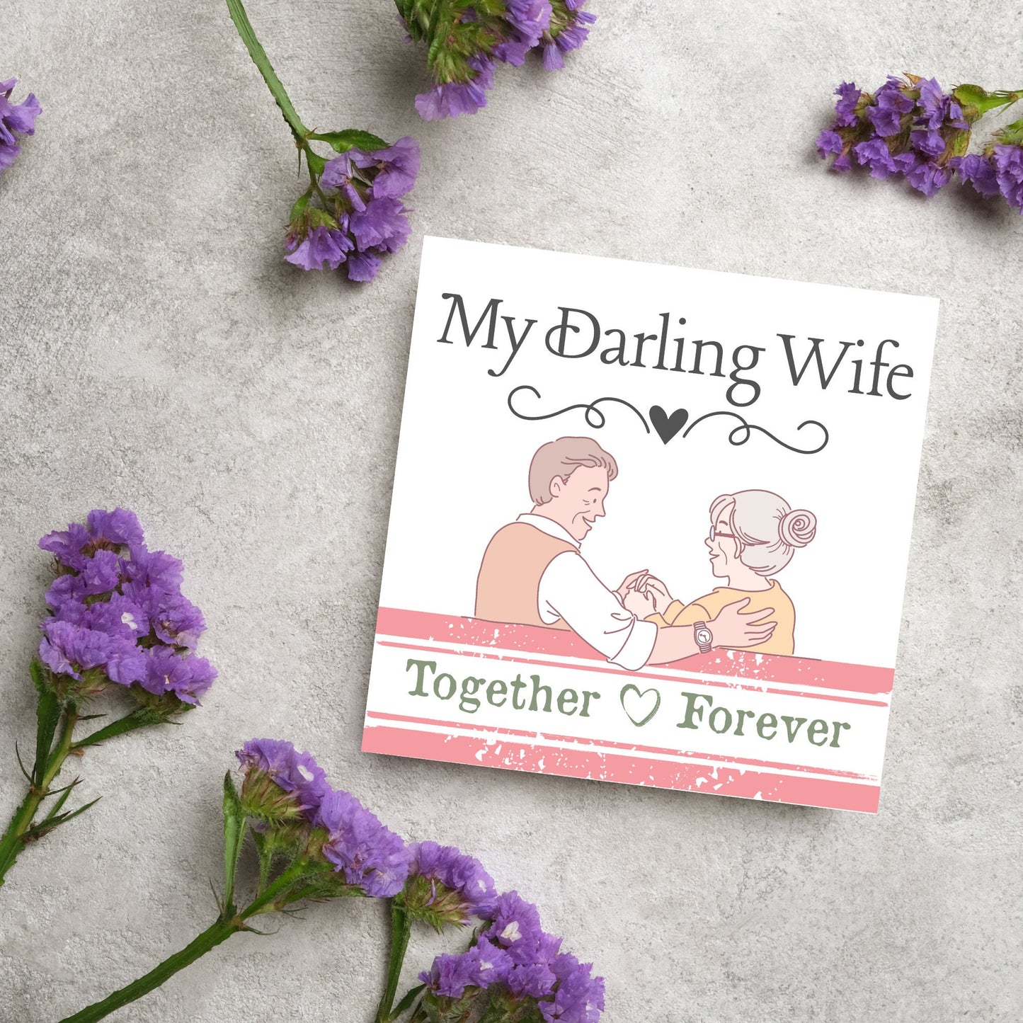 The Card has an illistration of a married couple holding hands. The Caption Reads 'My Darling Wife - Together Forever'. The Card is printed in pastel tones and is perfect for anniversaries or valentines day.