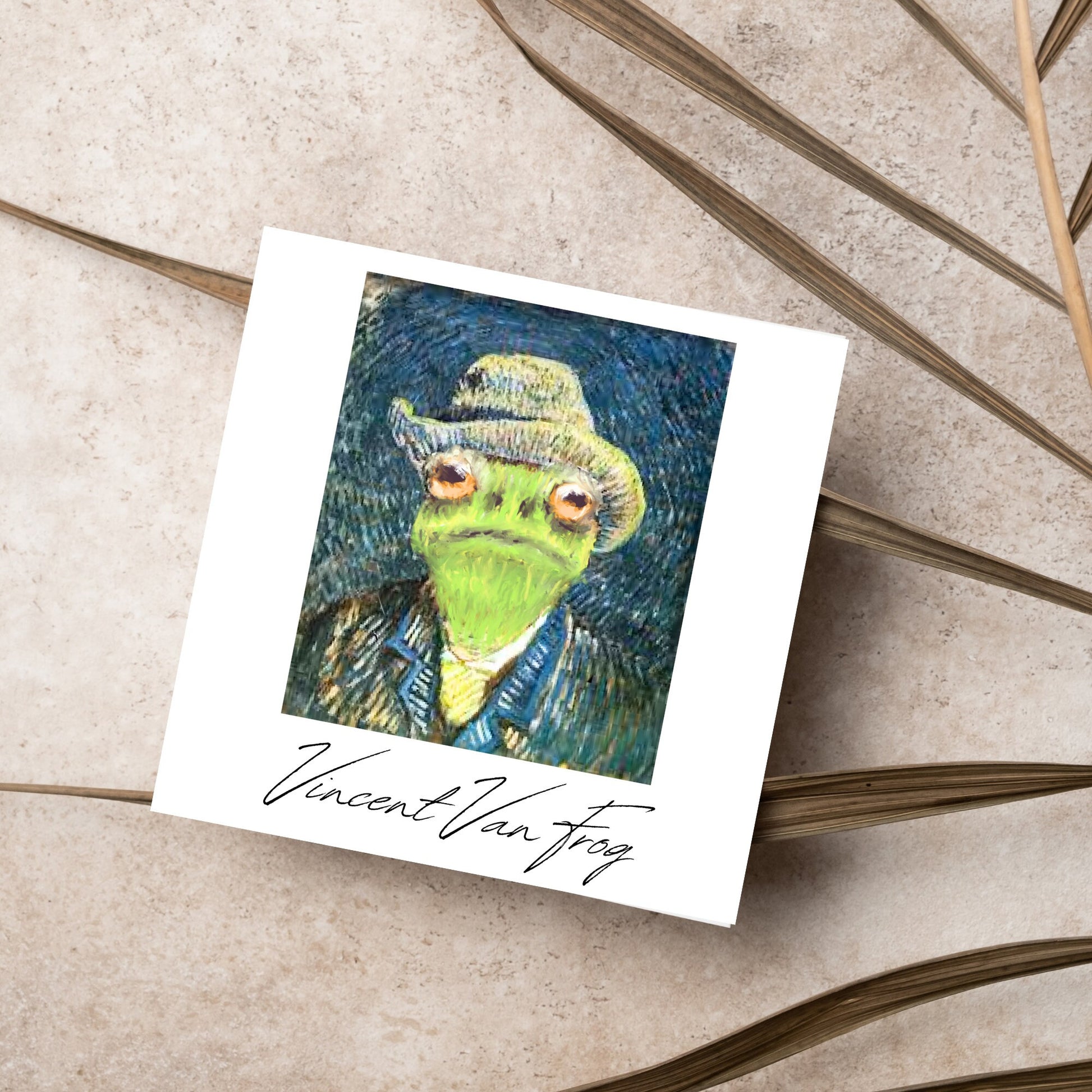 Image of a square greetings card with a remake of Vincent Van Gogh's famous self portrait but redone into a frog face. Underneath the painting the text reads Vincent Van Frog in a signature style