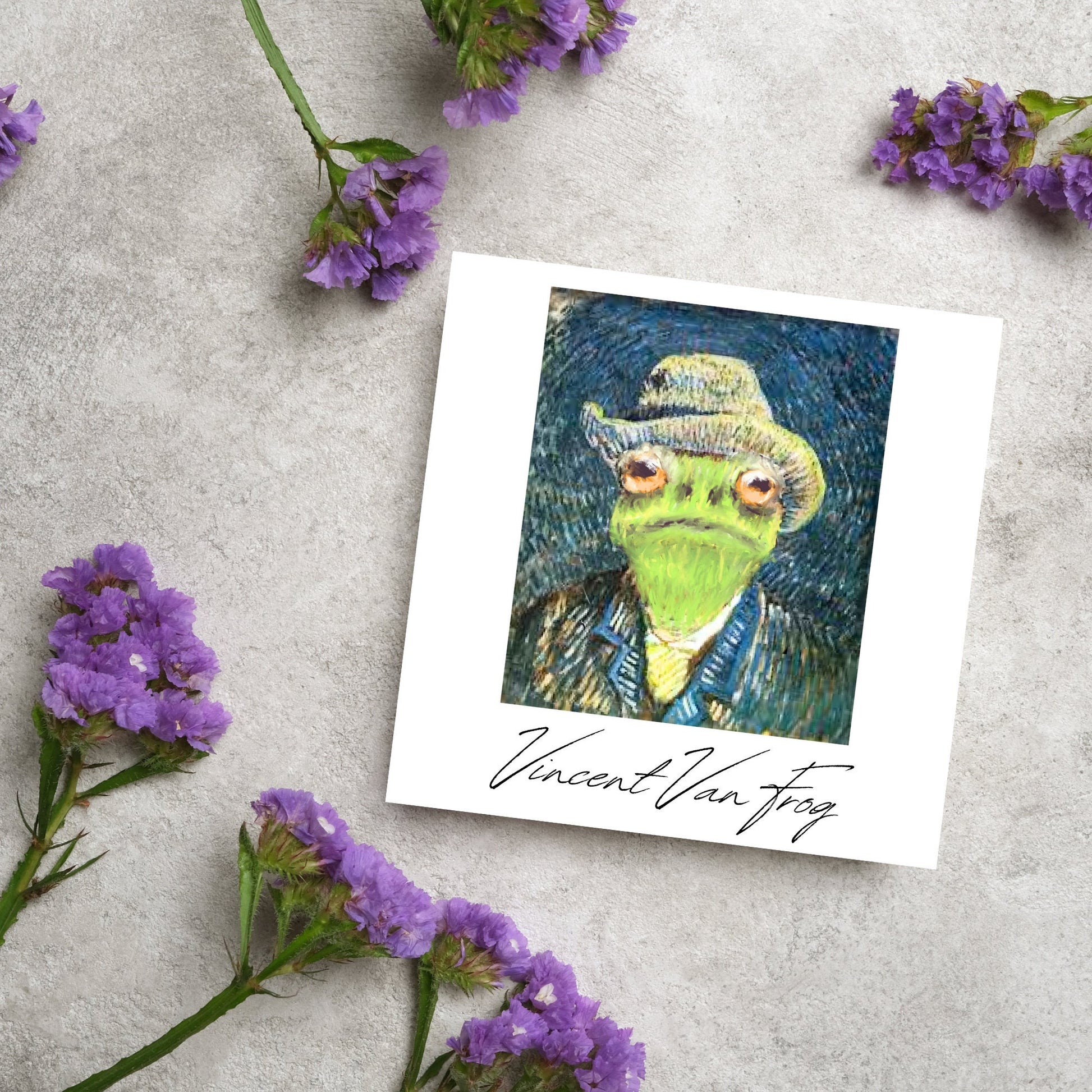 Image of a square greetings card with a remake of Vincent Van Gogh's famous self portrait but redone into a frog face. Underneath the painting the text reads Vincent Van Frog in a signature style