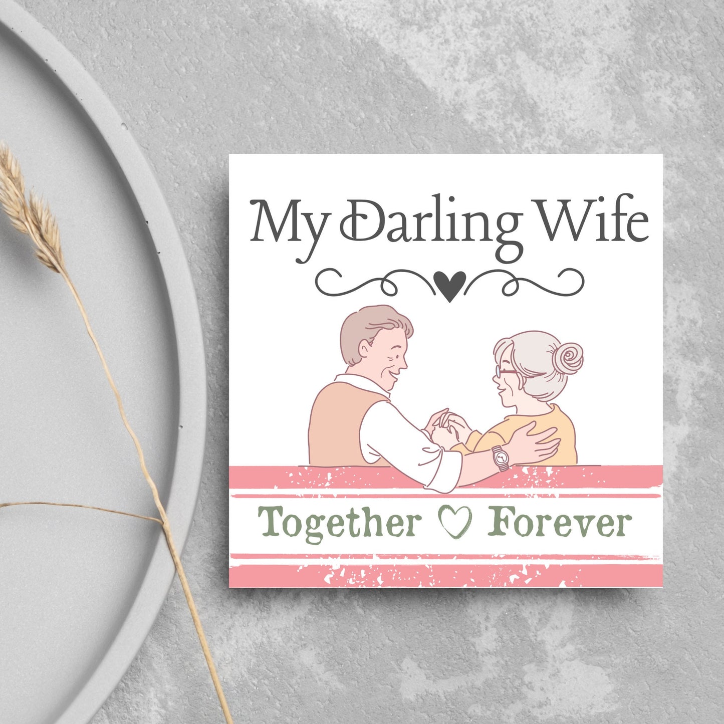 The Card has an illistration of a married couple holding hands. The Caption Reads 'My Darling Wife - Together Forever'. The Card is printed in pastel tones and is perfect for anniversaries or valentines day.