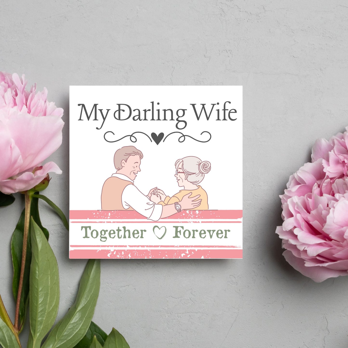 The Card has an illistration of a married couple holding hands. The Caption Reads 'My Darling Wife - Together Forever'. The Card is printed in pastel tones and is perfect for anniversaries or valentines day.