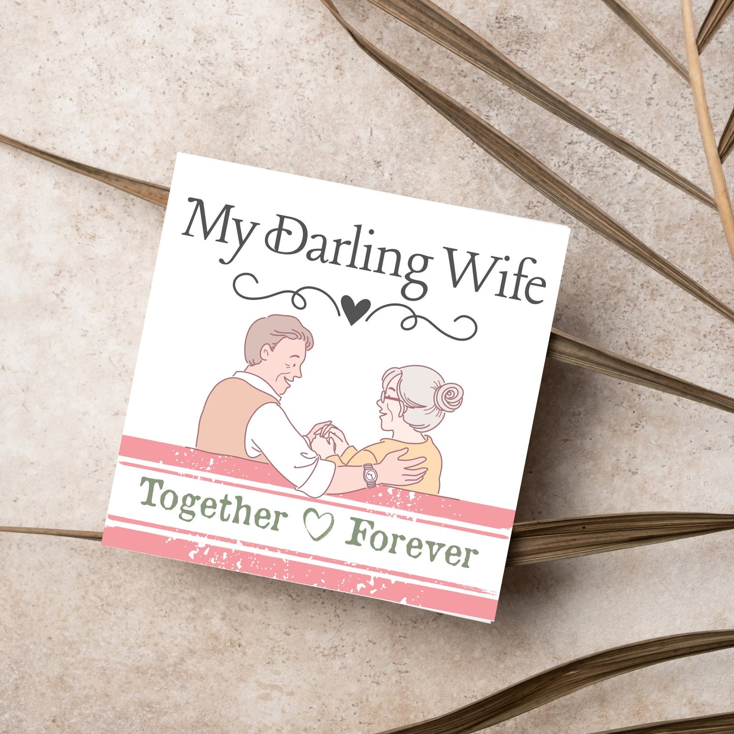 The Card has an illistration of a married couple holding hands. The Caption Reads 'My Darling Wife - Together Forever'. The Card is printed in pastel tones and is perfect for anniversaries or valentines day.