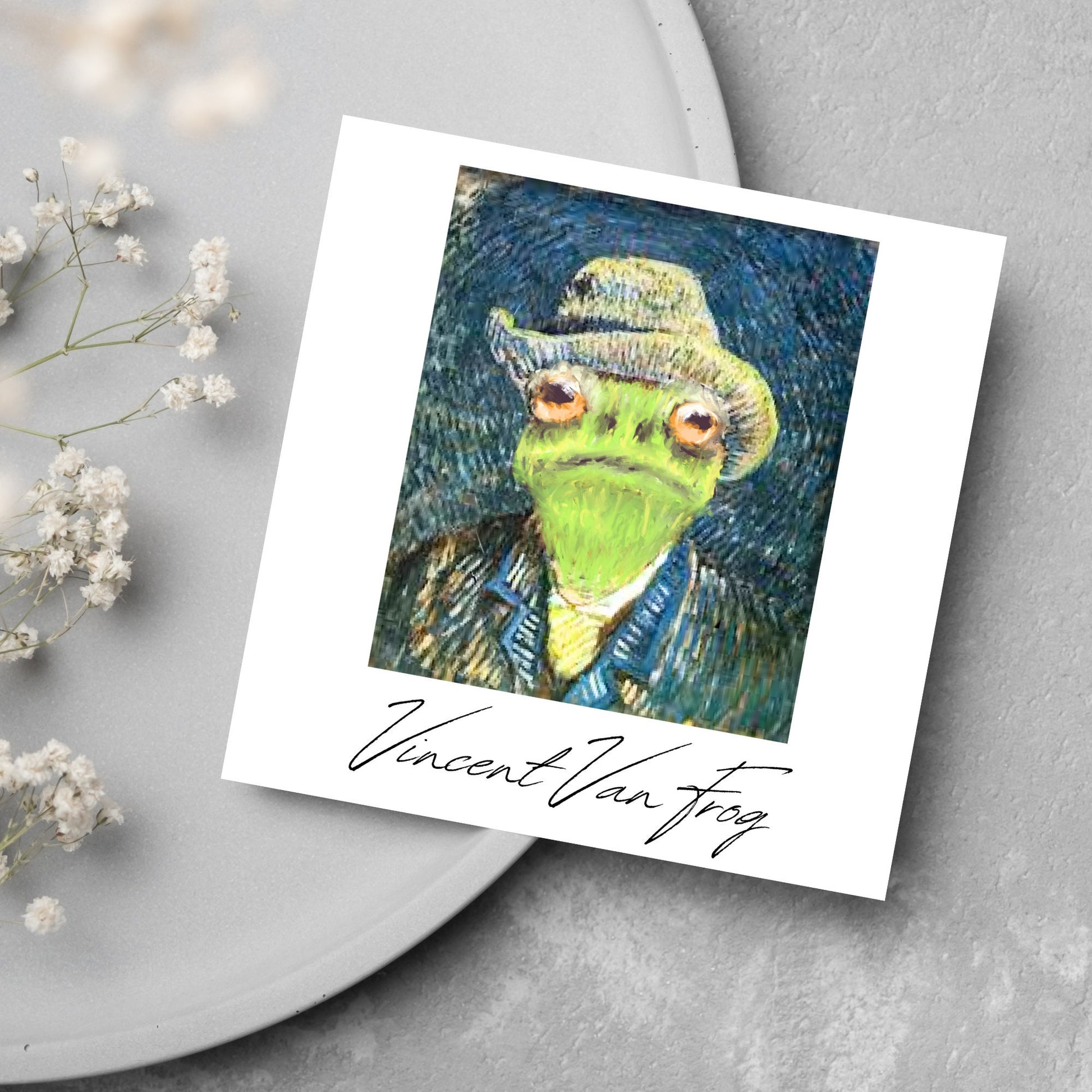 Image of a square greetings card with a remake of Vincent Van Gogh's famous self portrait but redone into a frog face. Underneath the painting the text reads Vincent Van Frog in a signature style