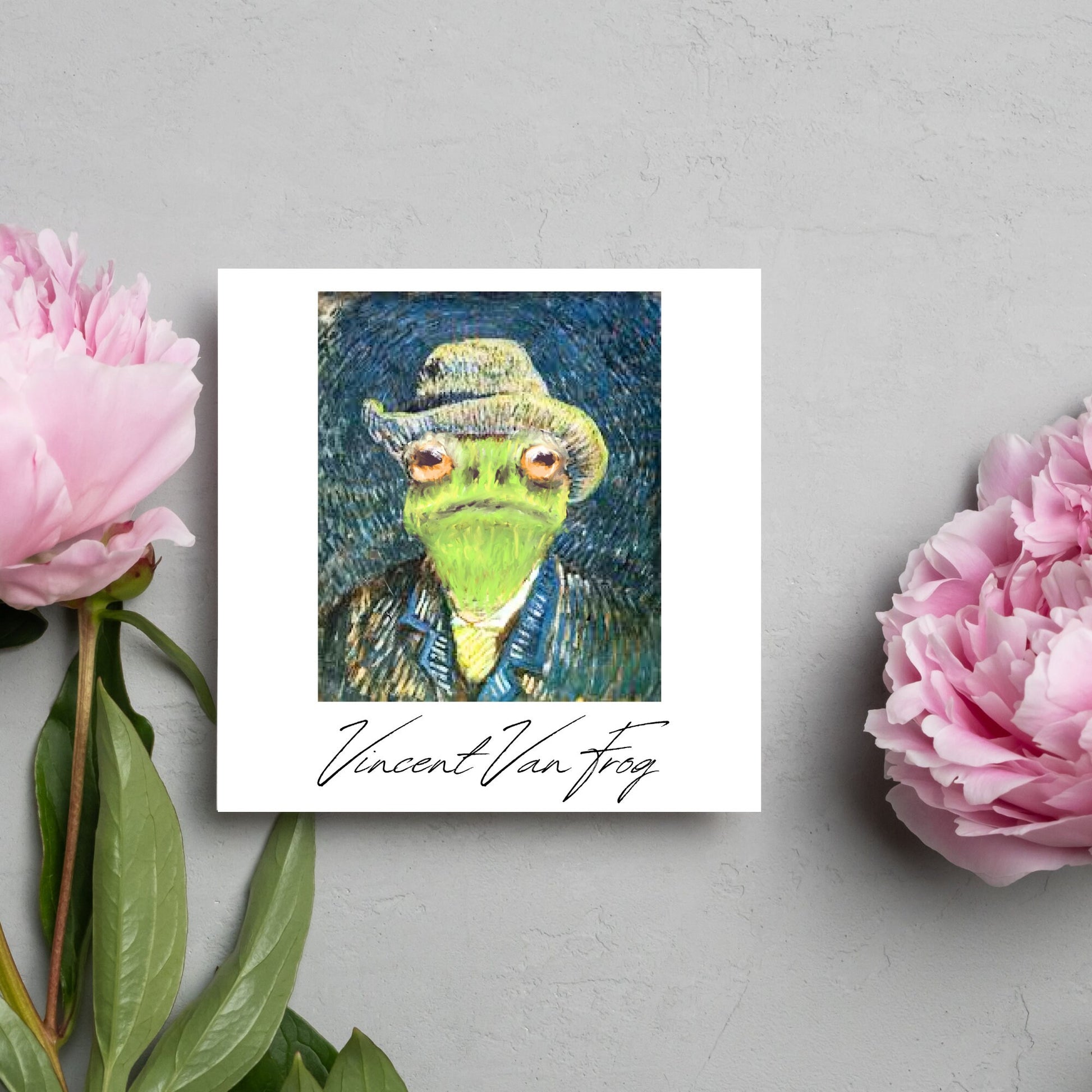 Image of a square greetings card with a remake of Vincent Van Gogh's famous self portrait but redone into a frog face. Underneath the painting the text reads Vincent Van Frog in a signature style