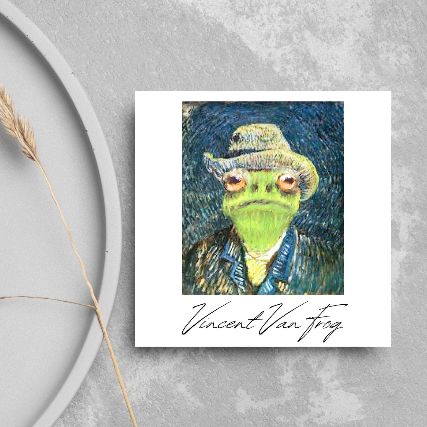 Image of a square greetings card with a remake of Vincent Van Gogh's famous self portrait but redone into a frog face. Underneath the painting the text reads Vincent Van Frog in a signature style