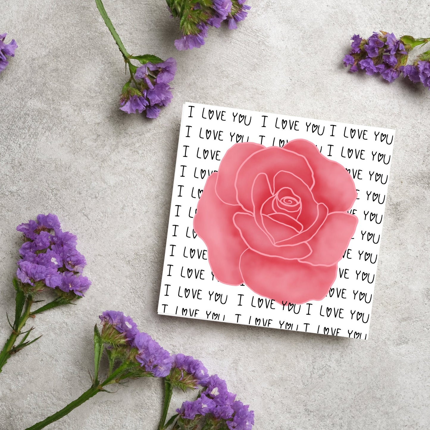 simple elegant card for valentines or anniversary, featuring a large pink rose painting with a background of handwritten style text that repeats 'I love you' with hearts instead of o's