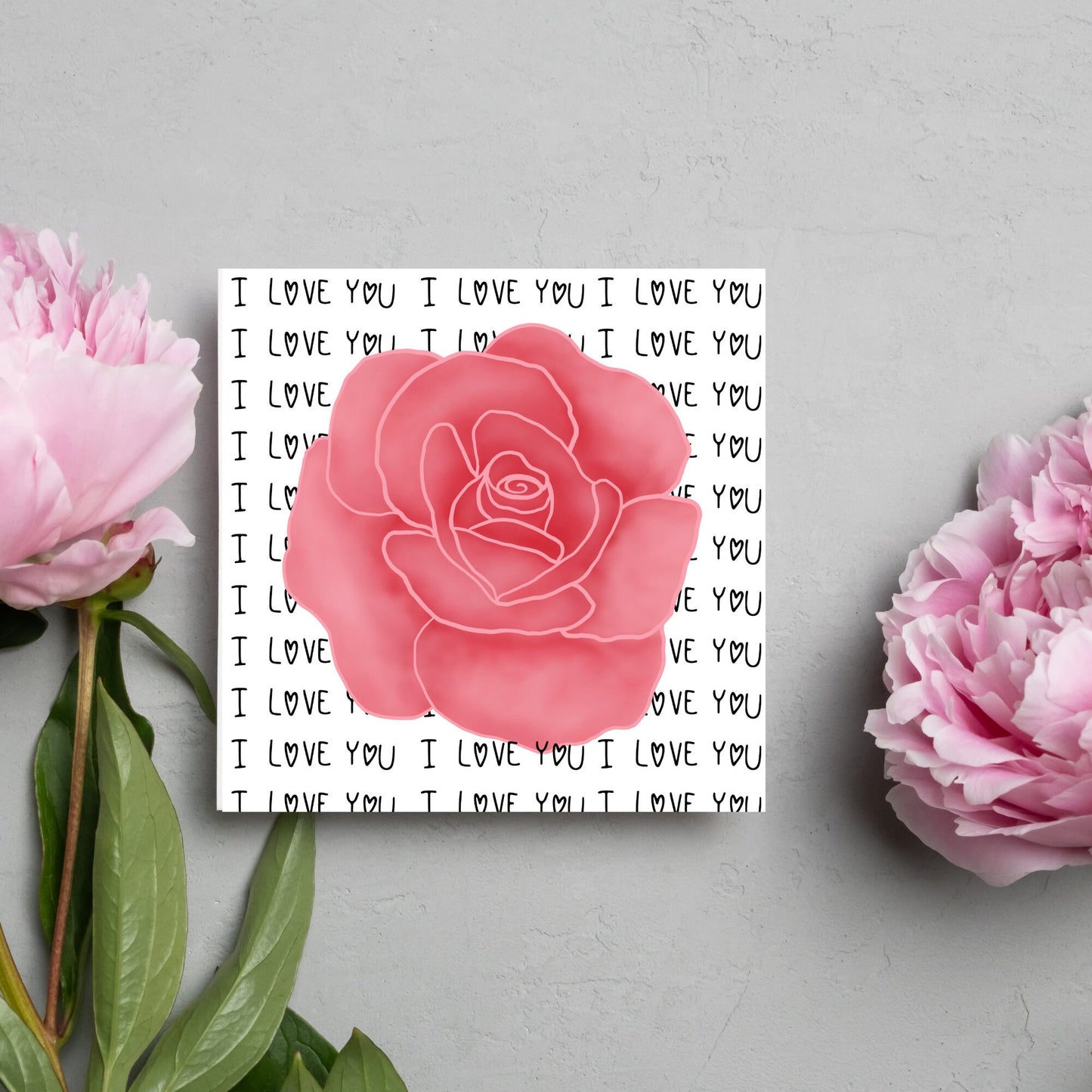 simple elegant card for valentines or anniversary, featuring a large pink rose painting with a background of handwritten style text that repeats 'I love you' with hearts instead of o's