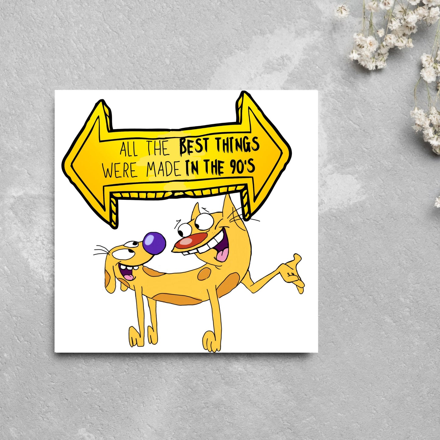 square card featuring an illustration of catdog with a yellow and black sign above them with the text that reads 'all the best things were' made in the 90's' in the font from the shows title