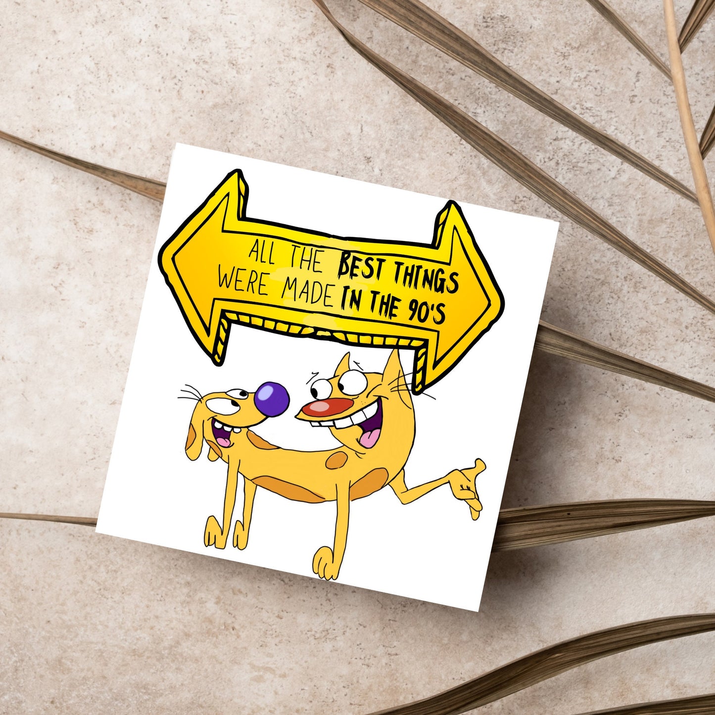 square card featuring an illustration of catdog with a yellow and black sign above them with the text that reads 'all the best things were' made in the 90's' in the font from the shows title