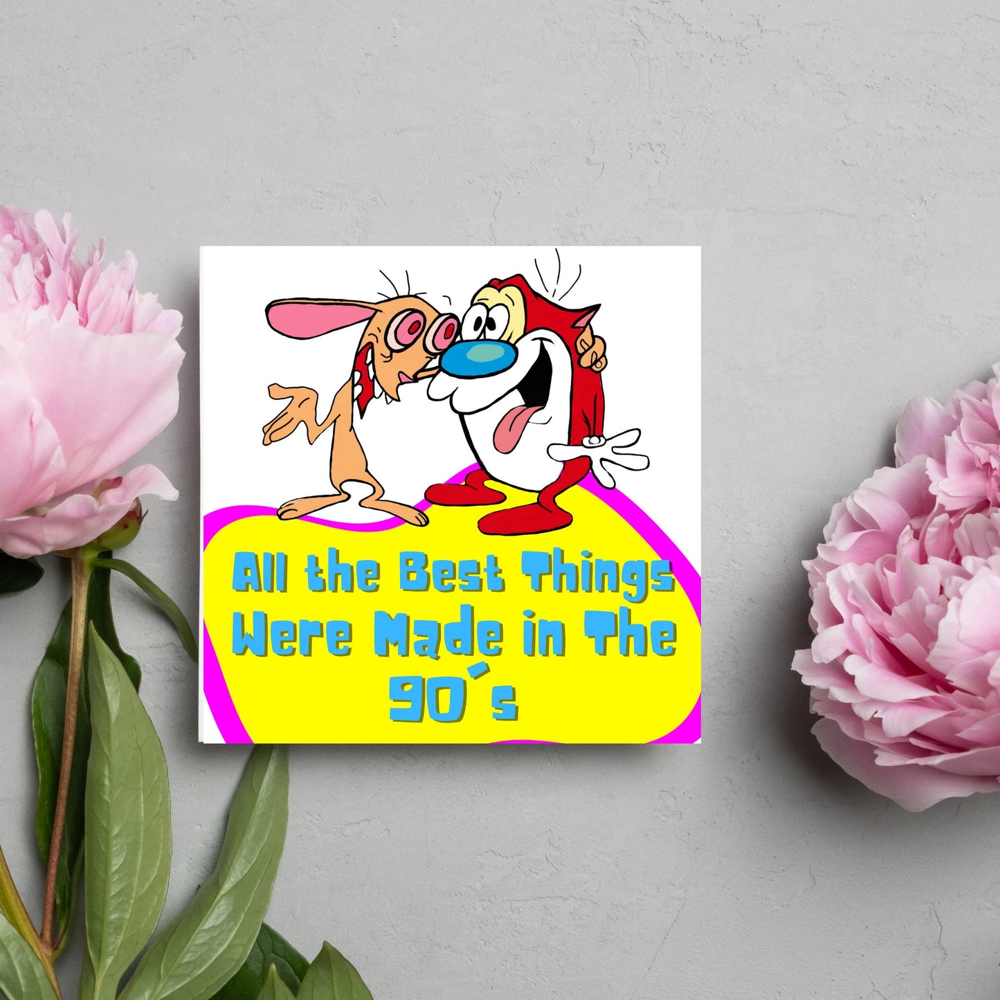 square card featuring an illustration of Ren and Stimpy arm in arm with blue pink and yellow text that reads 'all the best things were' made in the 90's' in the font from the shows title