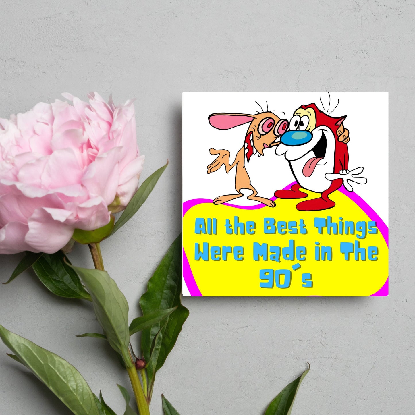square card featuring an illustration of Ren and Stimpy arm in arm with blue pink and yellow text that reads 'all the best things were' made in the 90's' in the font from the shows title