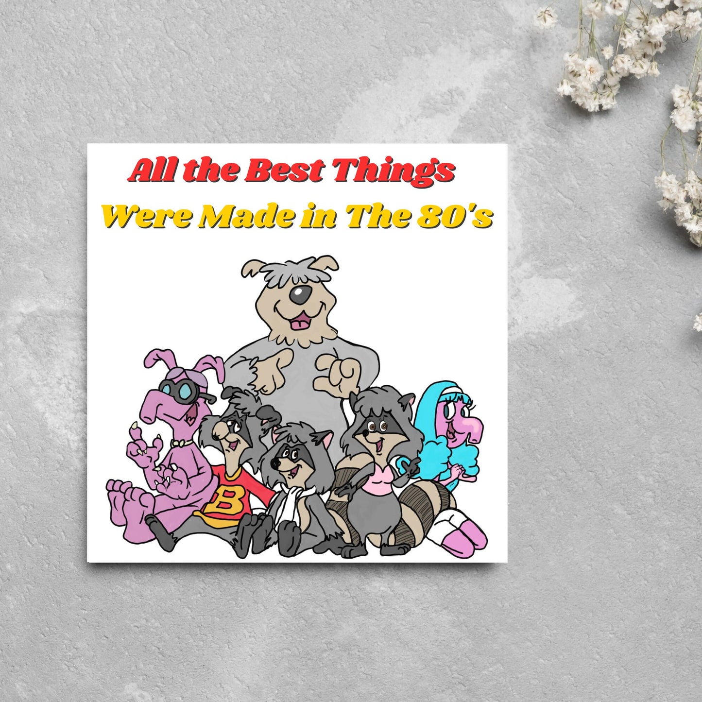 square card featuring an illustration of the raccoons from the tv cartoon with yellow and red text that reads 'all the best things were' made in the 80's' in the font from the shows title