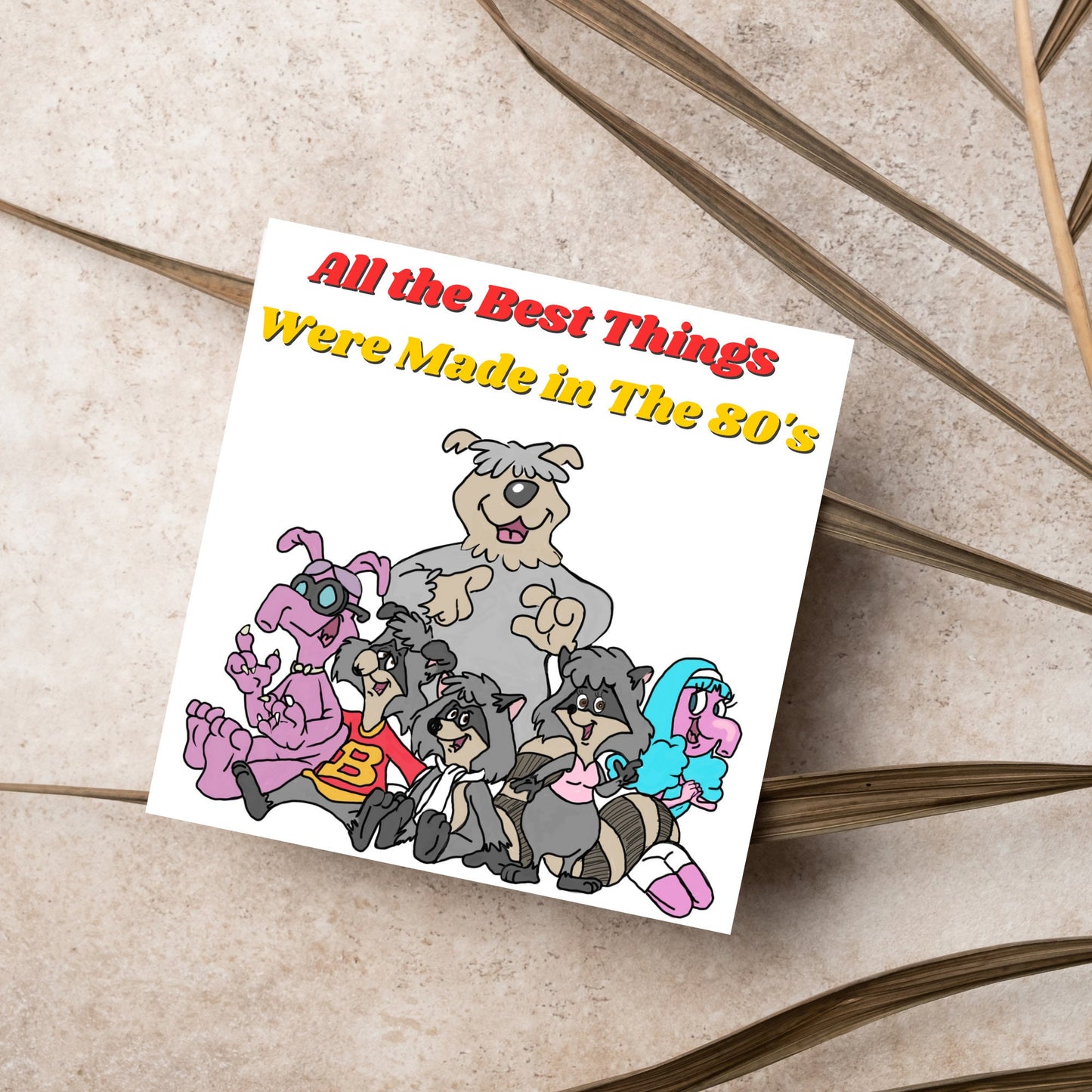 square card featuring an illustration of the raccoons from the tv cartoon with yellow and red text that reads 'all the best things were' made in the 80's' in the font from the shows title