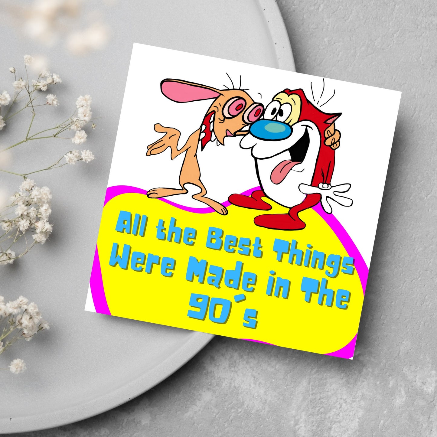 square card featuring an illustration of Ren and Stimpy arm in arm with blue pink and yellow text that reads 'all the best things were' made in the 90's' in the font from the shows title