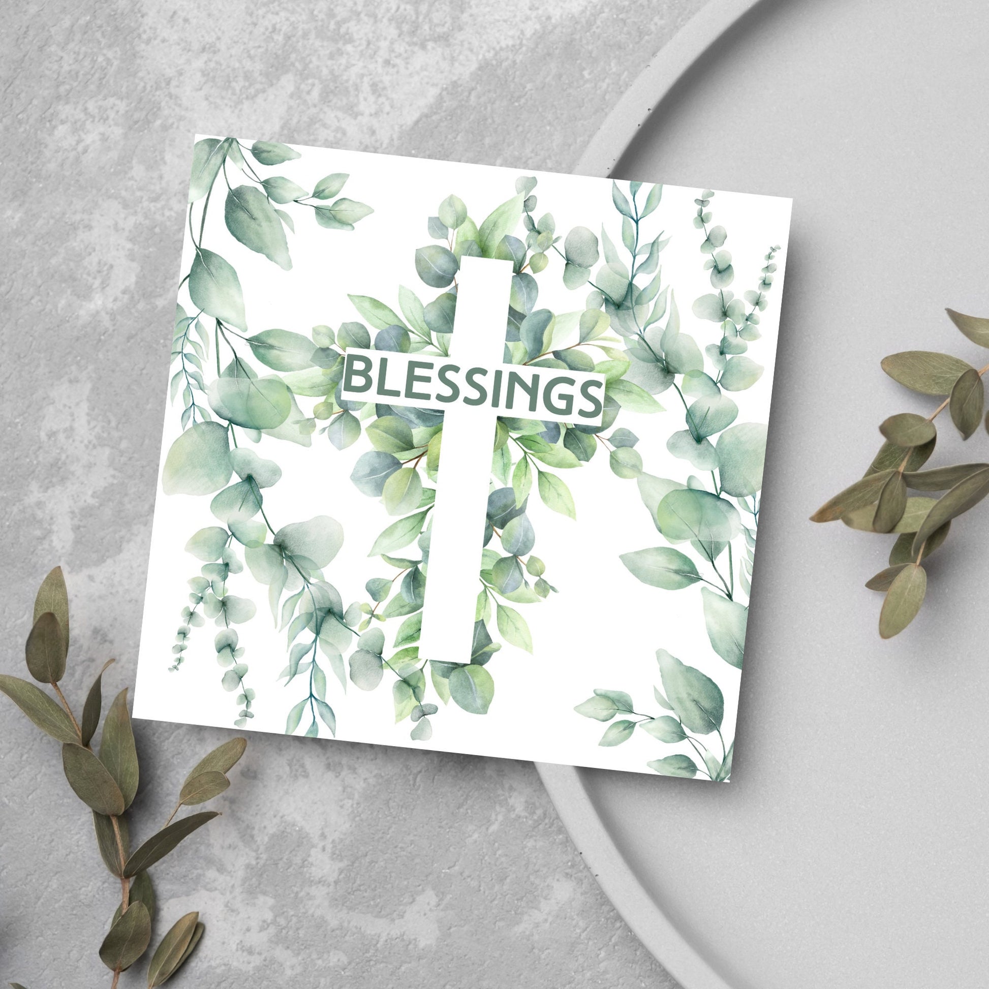blessings card with green foliage and a cross
