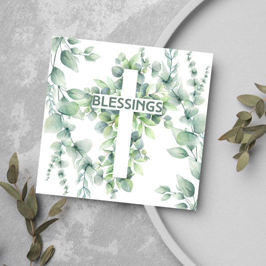 blessings card with green foliage and a cross