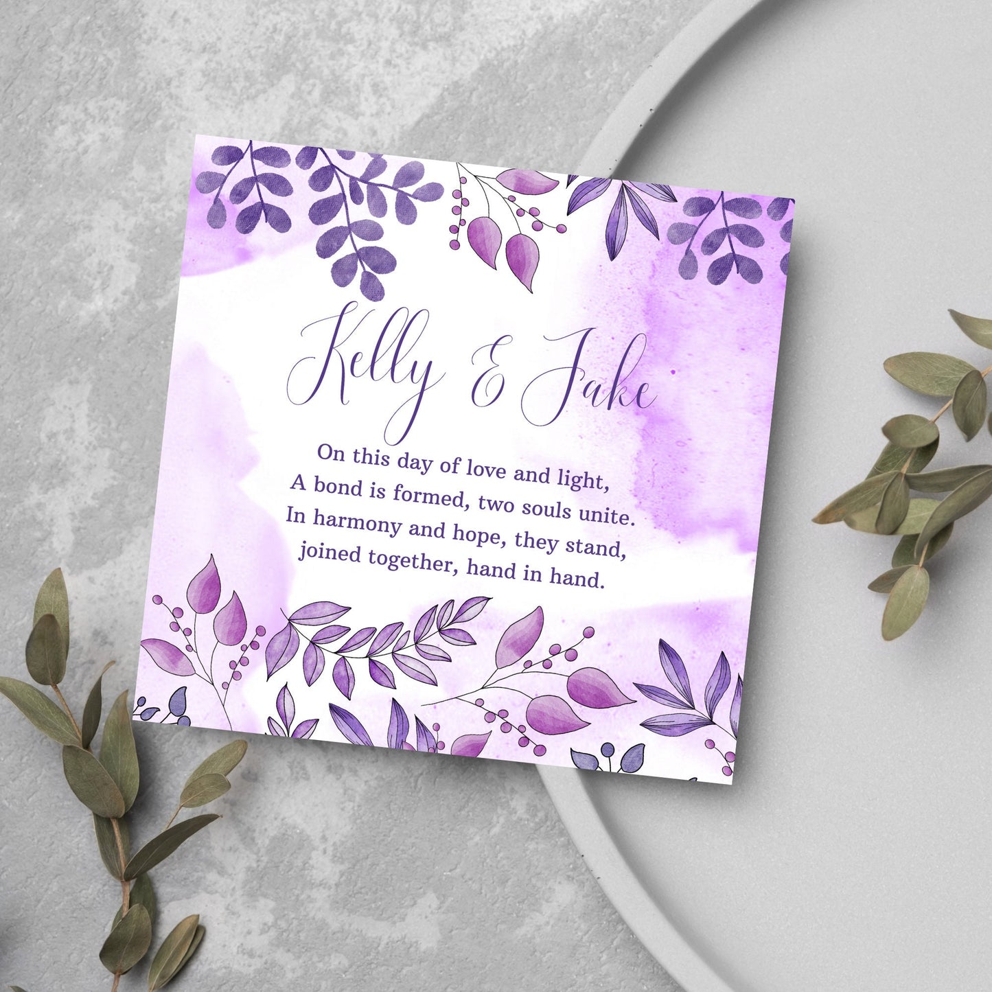 purple wedding card with floral design, names and poem