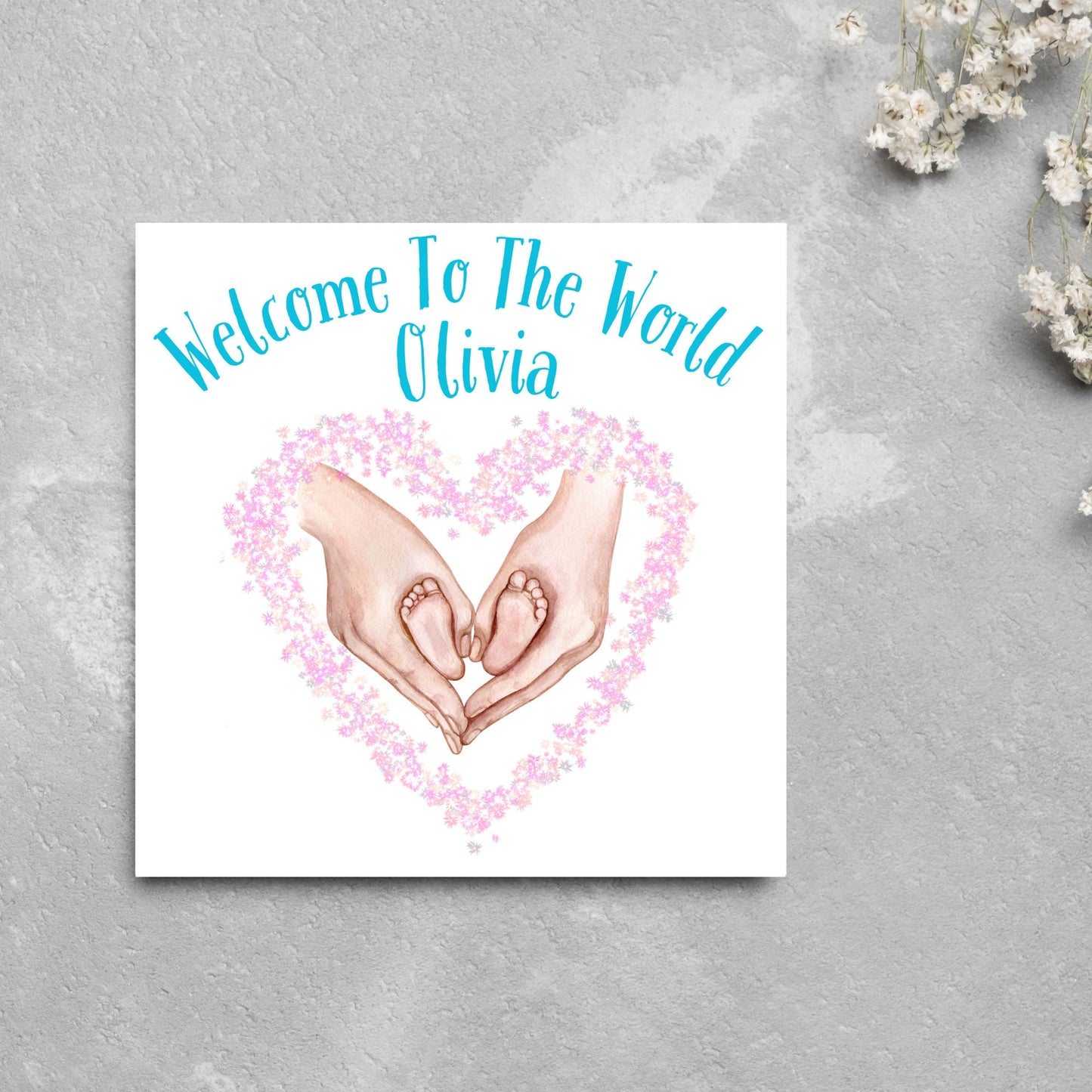 welcome to the world, baby feet in hands making heart
