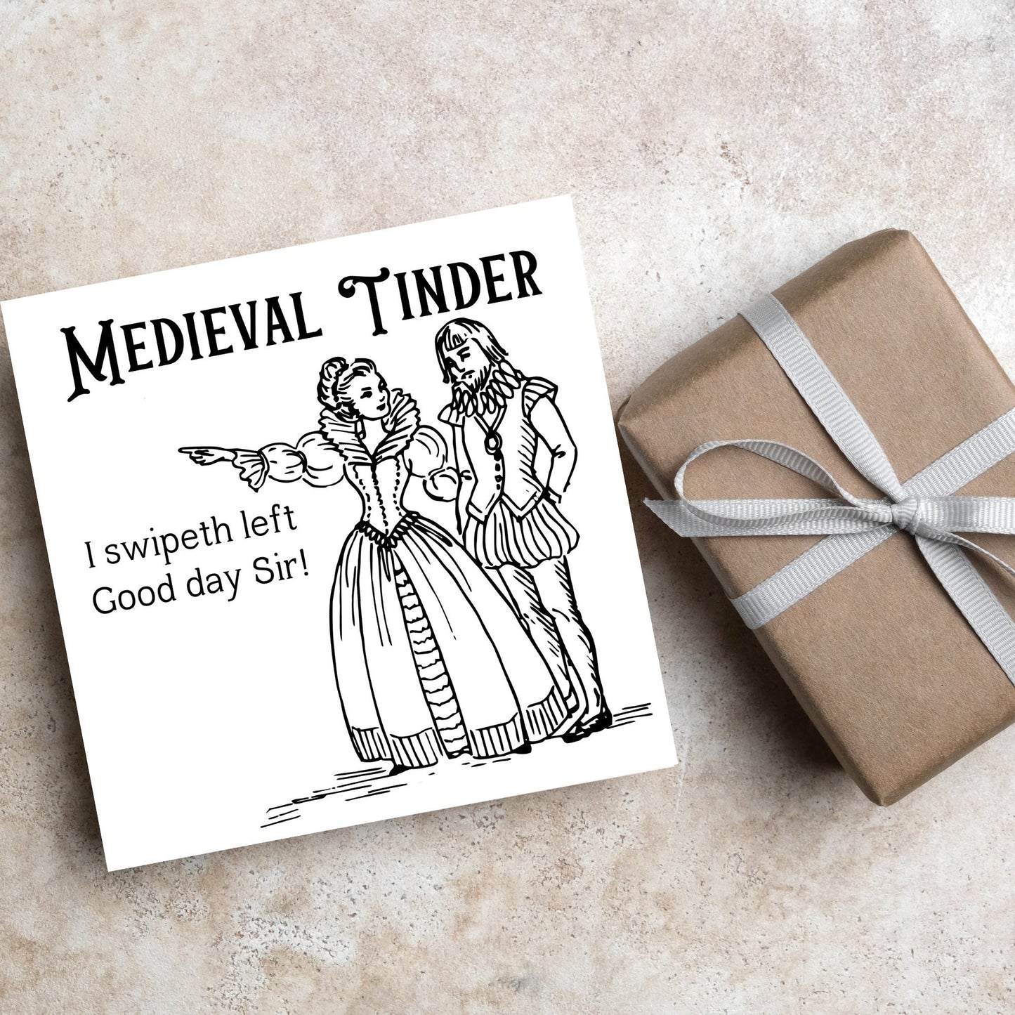 image of a square greetings card with a black and white hand drawn vintage style illustration of medieval man and woman, the woman pointing left and the text - medieval tinder. I swipeth left. Good day Sir! - in a vintage blackletter font