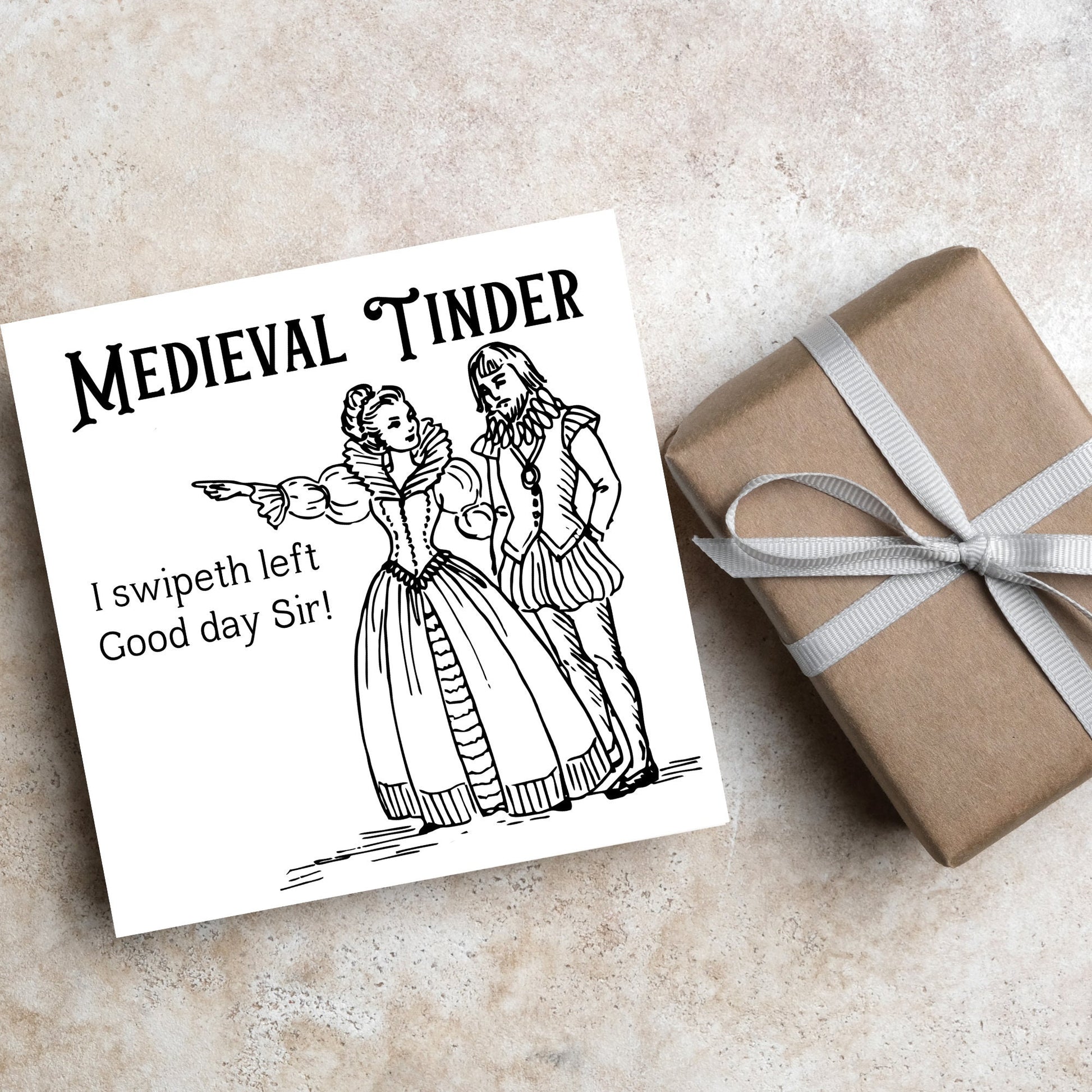 image of a square greetings card with a black and white hand drawn vintage style illustration of medieval man and woman, the woman pointing left and the text - medieval tinder. I swipeth left. Good day Sir! - in a vintage blackletter font