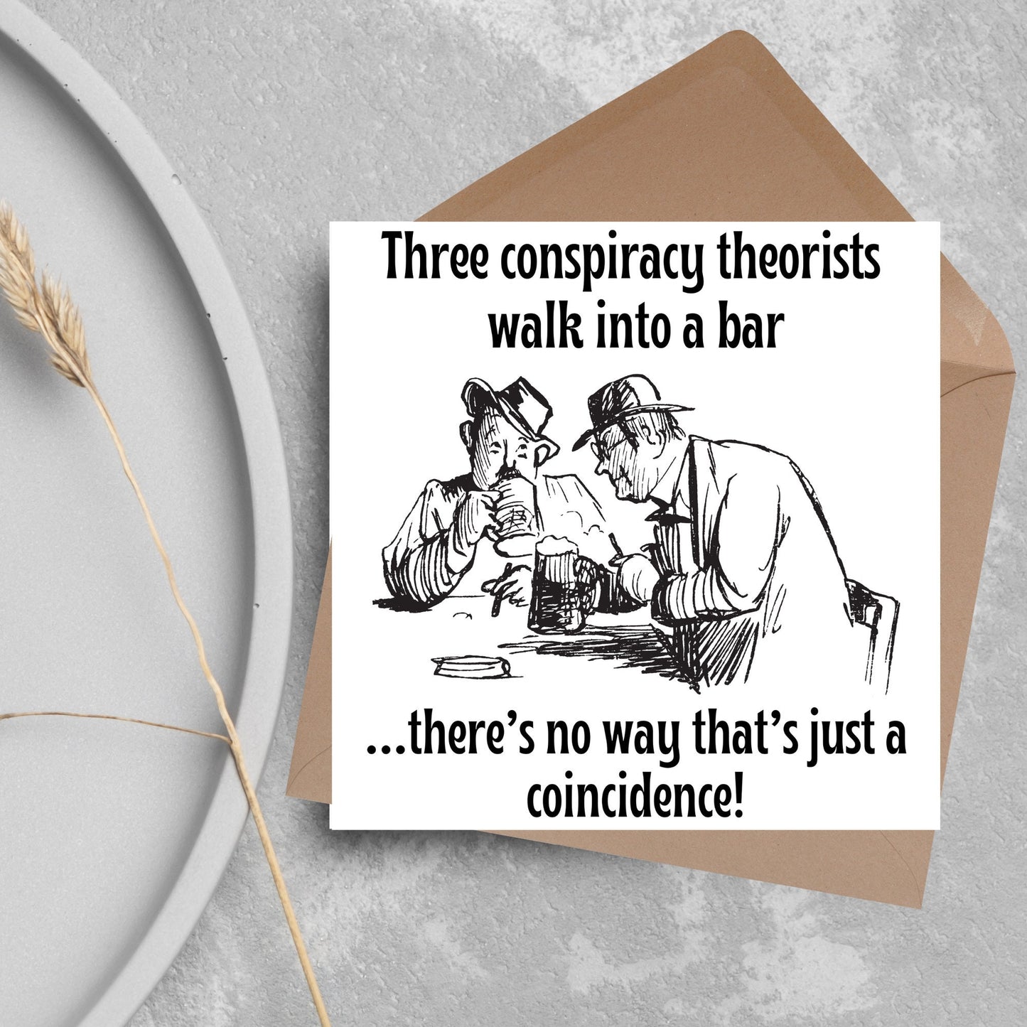 Image of a square greetings card with a hand drawn black and white line cartoon sketch of two old men at a bar drinking beer with the text- 3 conspiracy theorists walk into a bar....there's no way that's just a coincidence!
