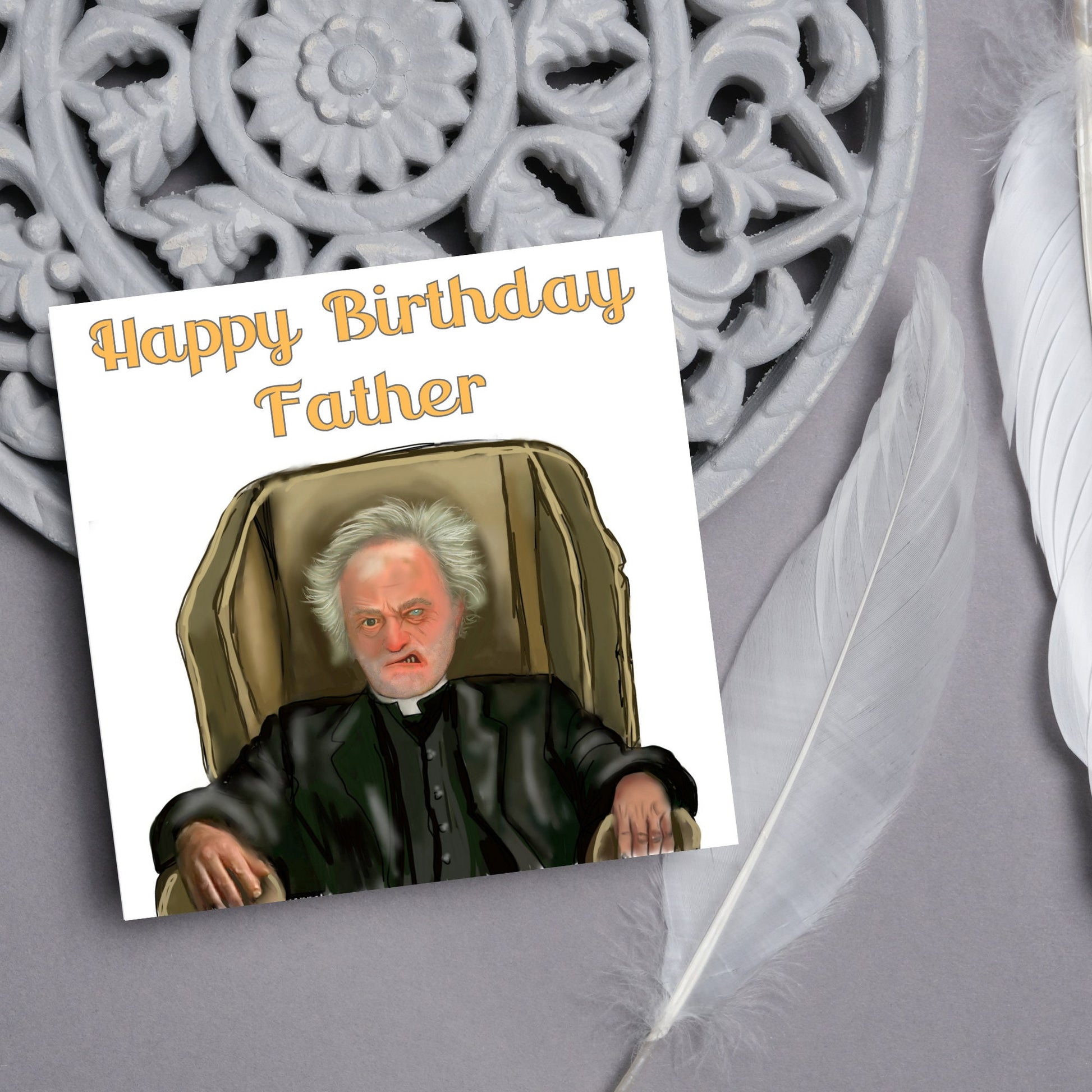square birthday card with a hand drawn image of father jack from the tv show father ted. he is sitting in his chair looking mean with the text happy birthday father