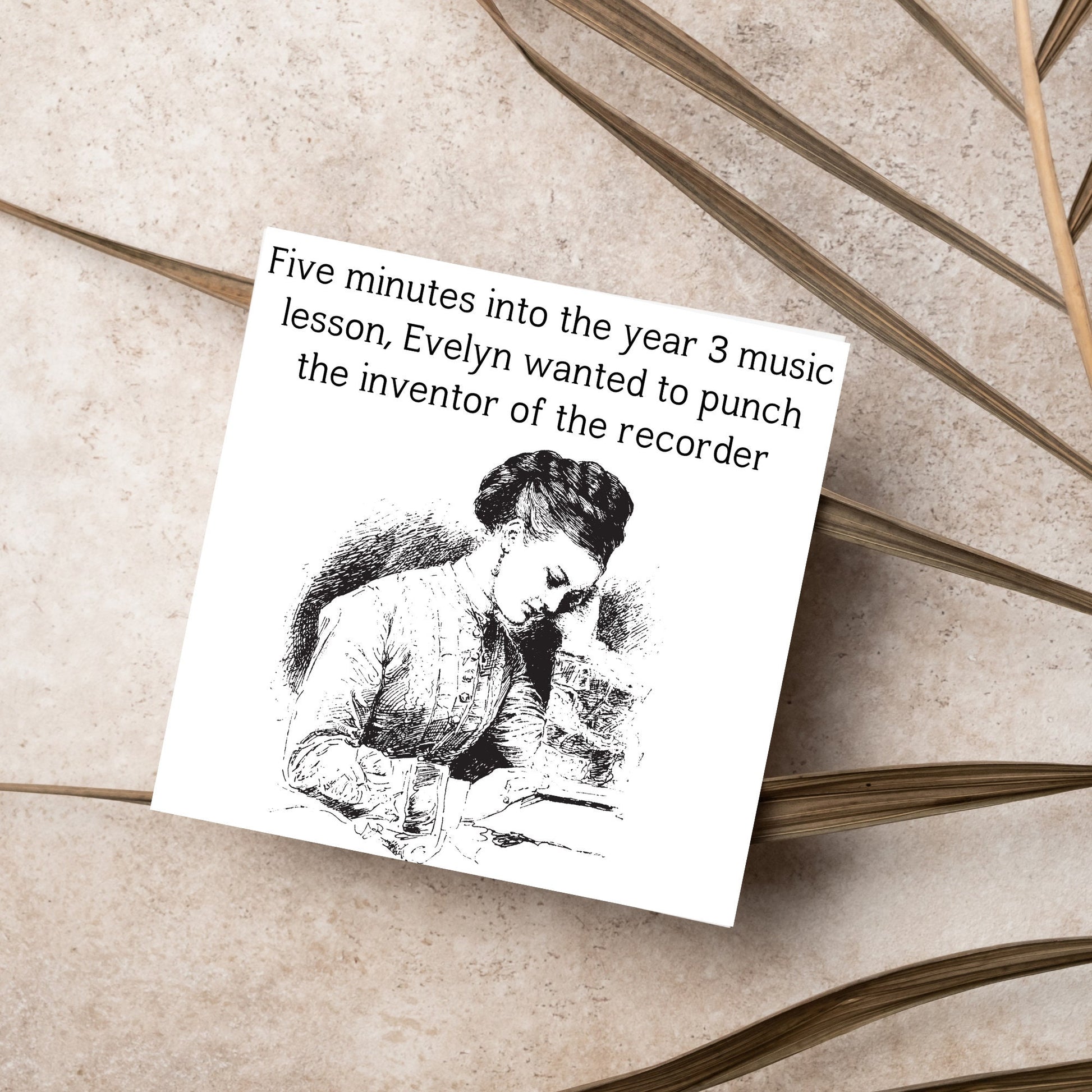 Image of a square greetings card with a black and white line drawing of a victorian lady sitting at a desk with her head in her hands and the text - five minutes into the tear 3 music lesson, evelyn wanted to punch the inventor of the recorder